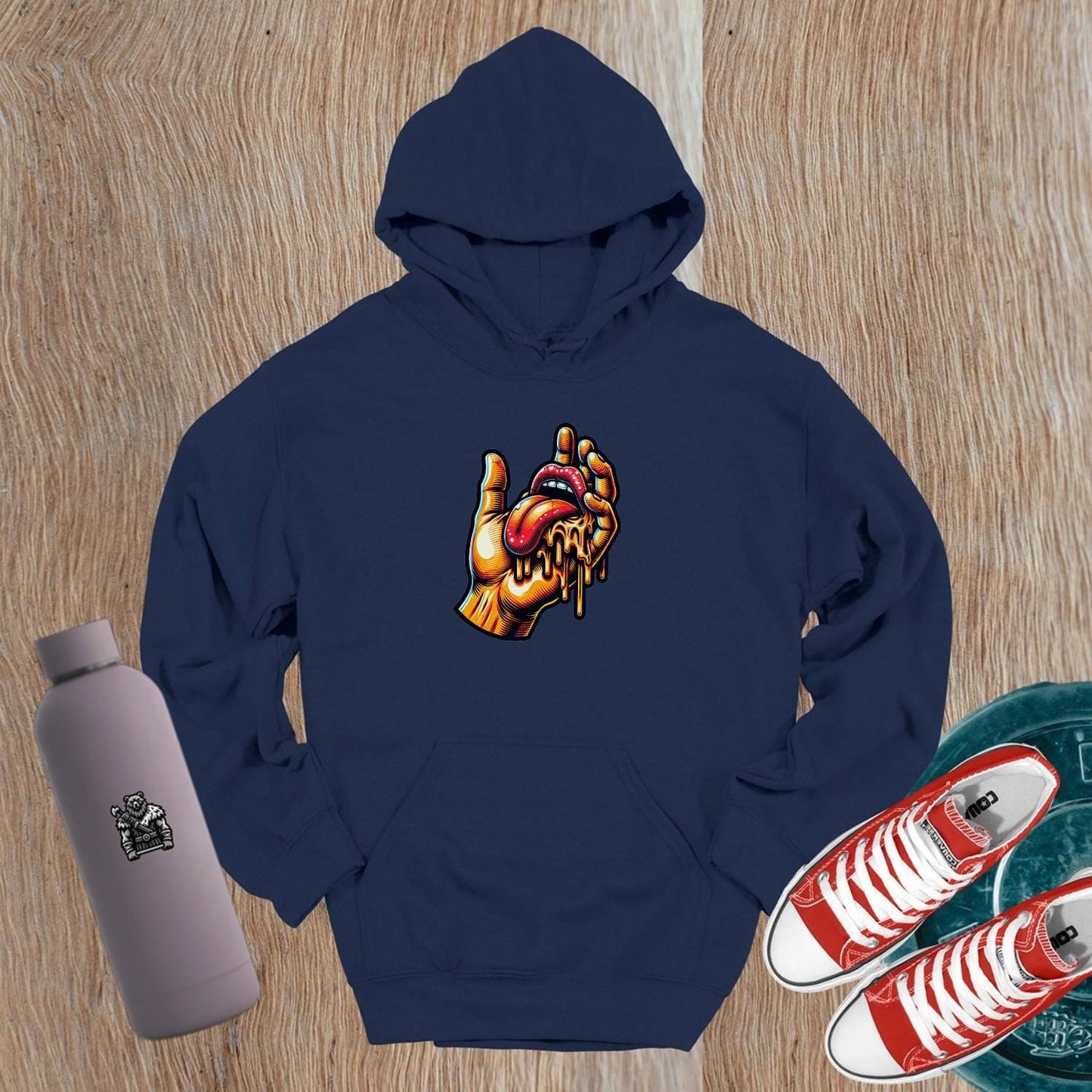"Bold gym hoodie featuring vibrant graphic of a hand and dripping tongue, perfect for workouts and casual outings, embodying fierce style."