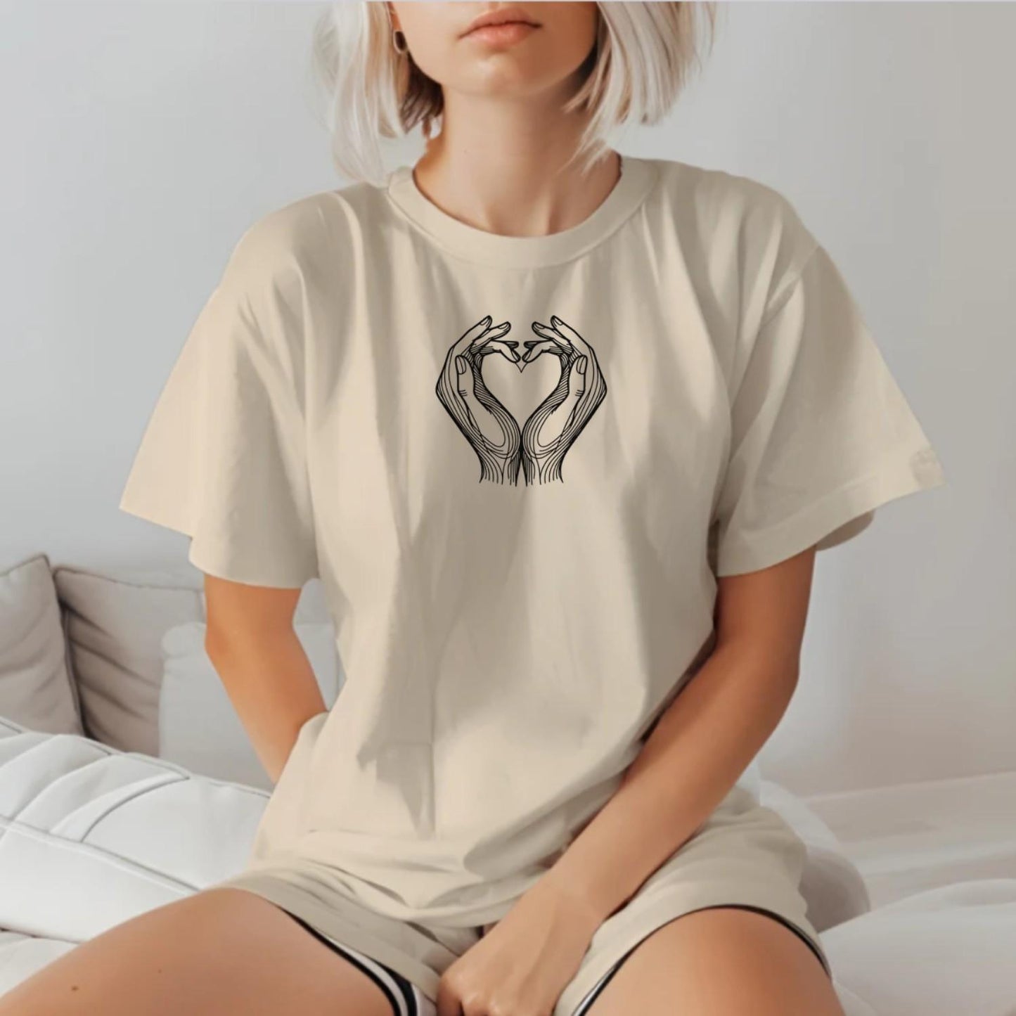 "Heart Hands T-Shirt featuring a bold heart design created by two hands, perfect for gym workouts and casual fitness wear."