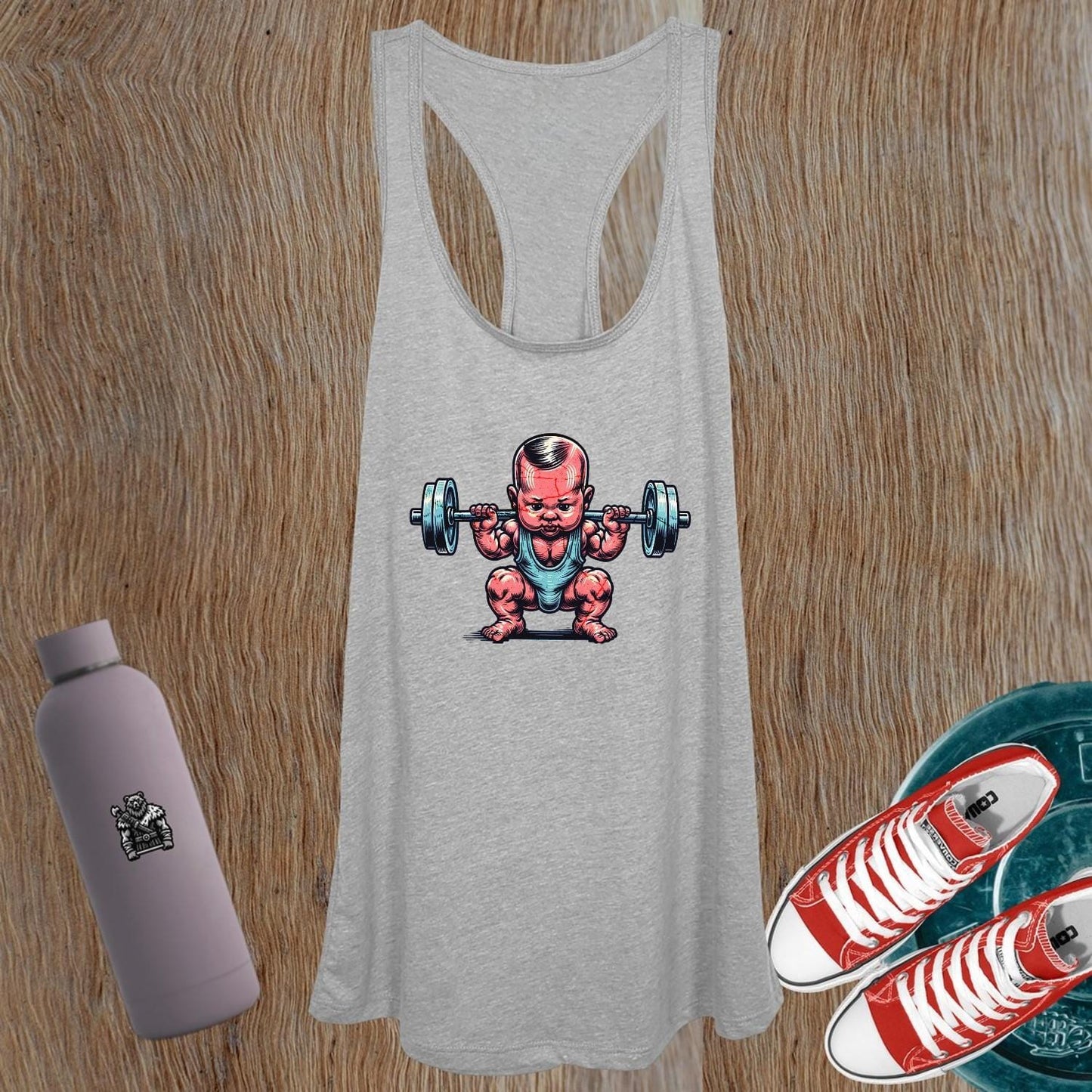 "Cheeky women's gym tank top featuring an adorable baby lifting weights, perfect for fitness motivation and stylish workouts."