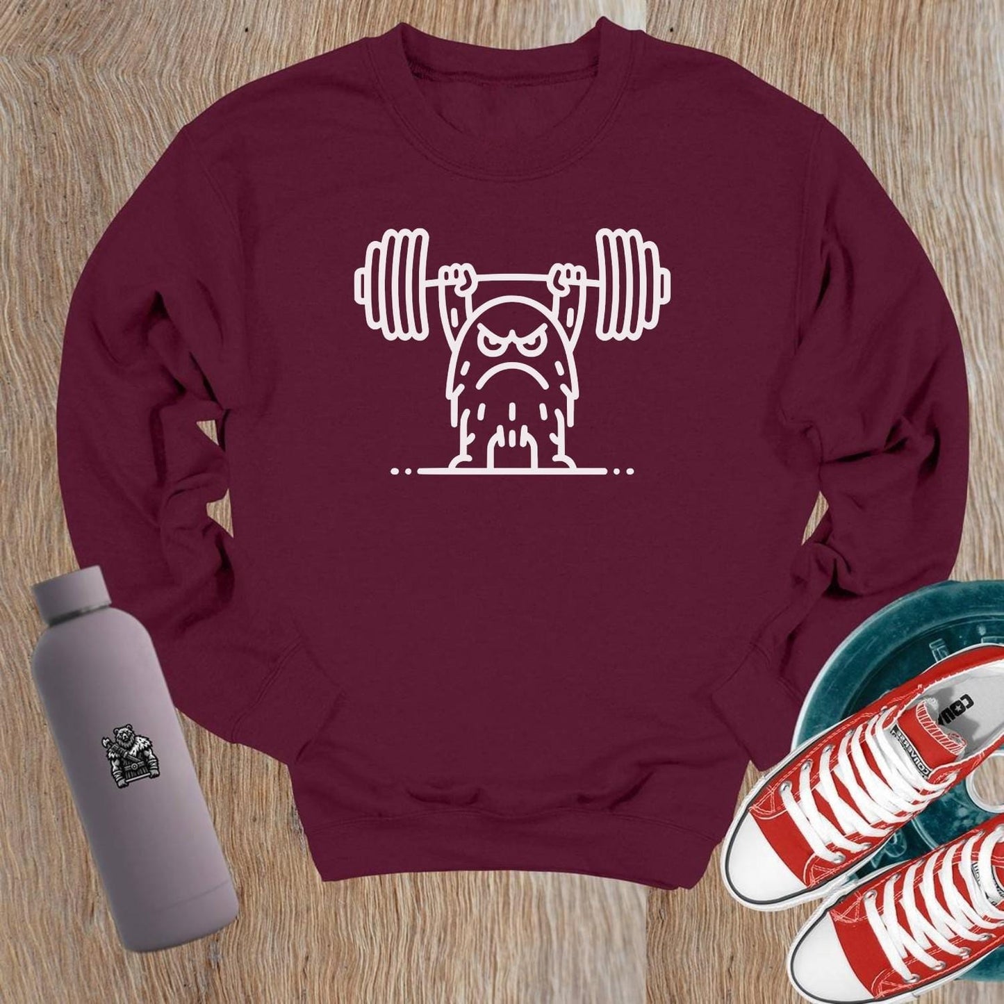 Alt text: "Bold gym crewneck sweatshirt featuring a gritty weightlifter graphic, perfect for workouts and lounging, ideal for fitness enthusiasts."