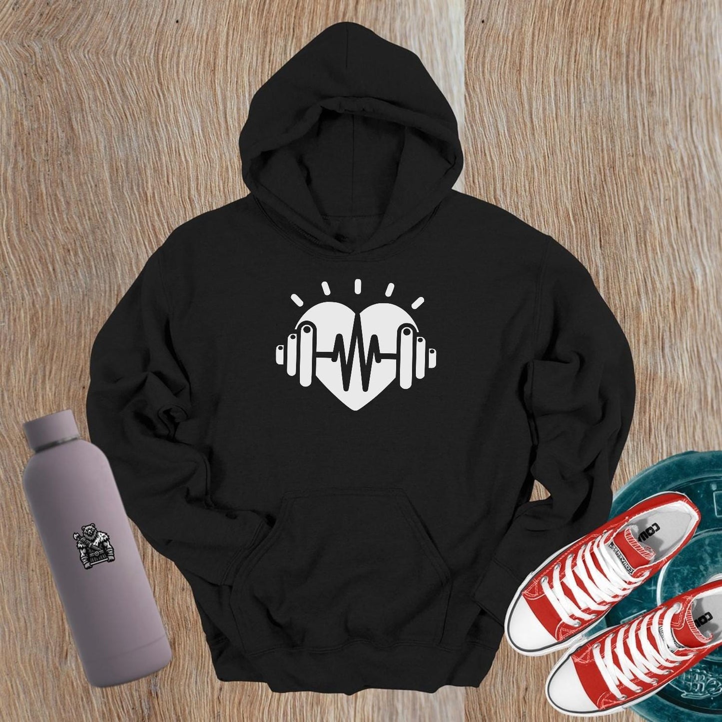 "Stylish fitness hoodie featuring a bold strength graphic, designed for workouts and casual wear. Embrace your fitness passion!"
