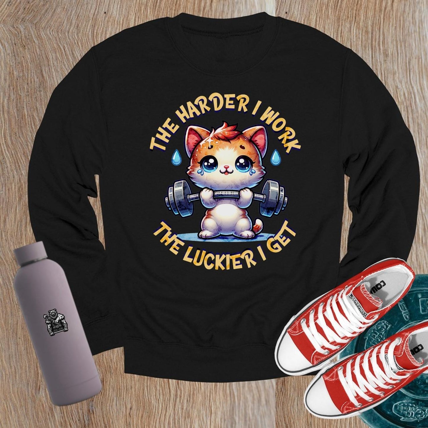 "Adorable crewneck sweatshirt featuring a cartoon kitty lifting weights, motivational design, perfect for gym workouts and lounging."