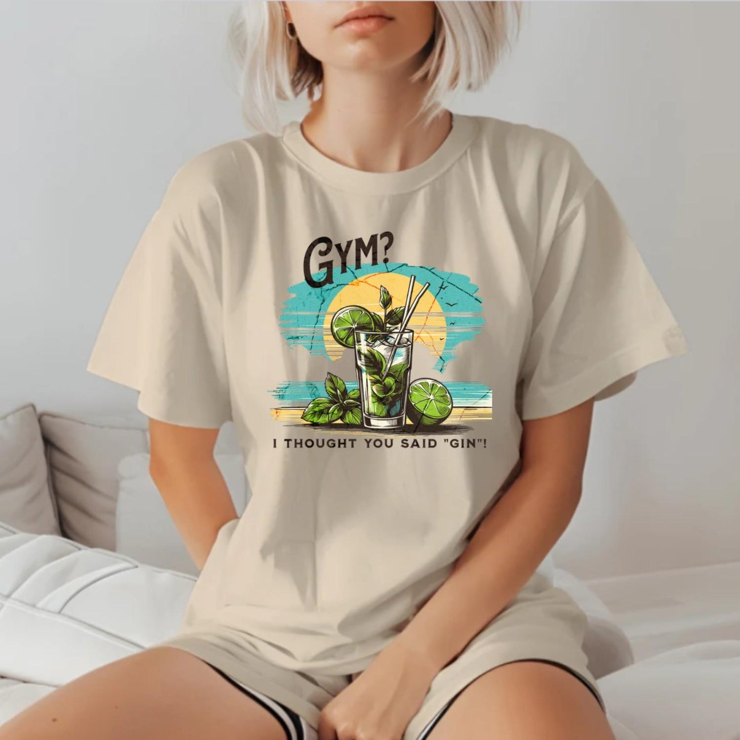 Alt text: "Fun graphic T-shirt featuring the humorous phrase 'GYM? I Thought You Said 'GIN'!' Perfect for fitness lovers and gym enthusiasts."