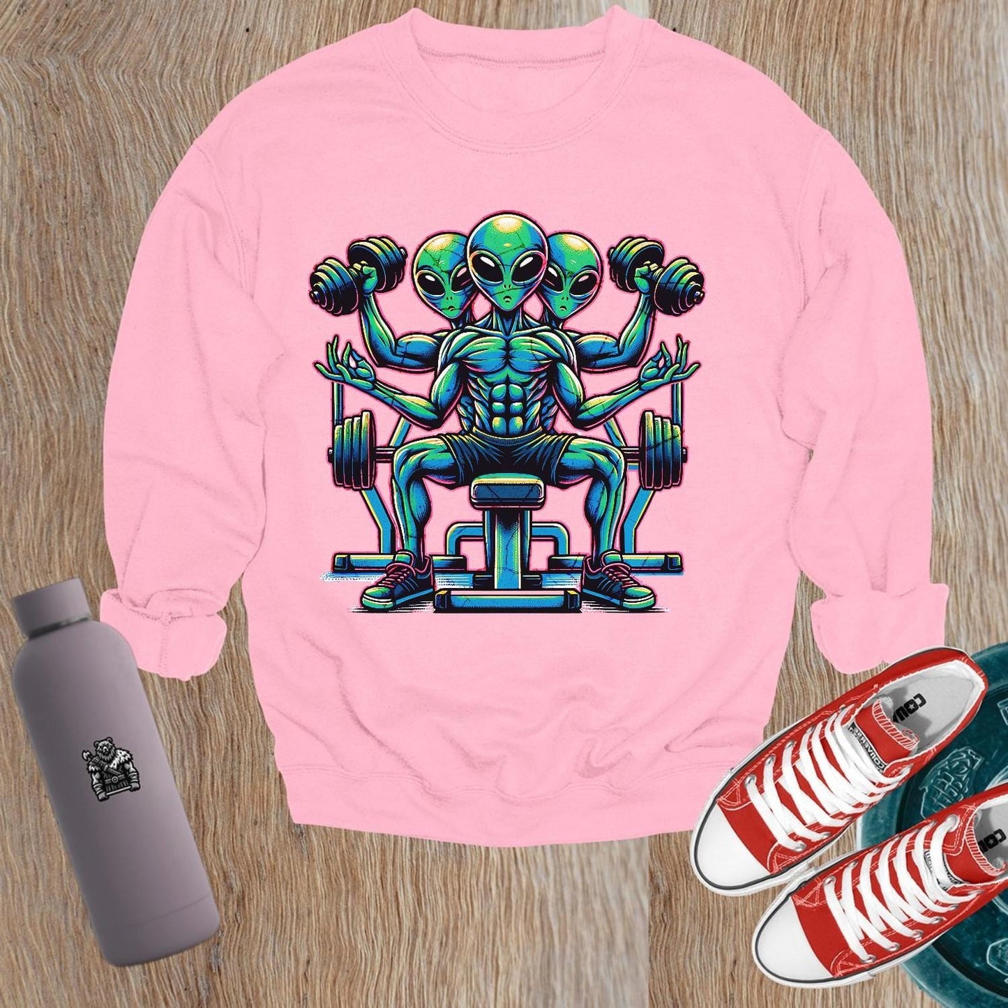 "Vibrant gym sweatshirt featuring a bold alien lifter graphic, perfect for fitness enthusiasts. Energetic design for workouts and casual wear."
