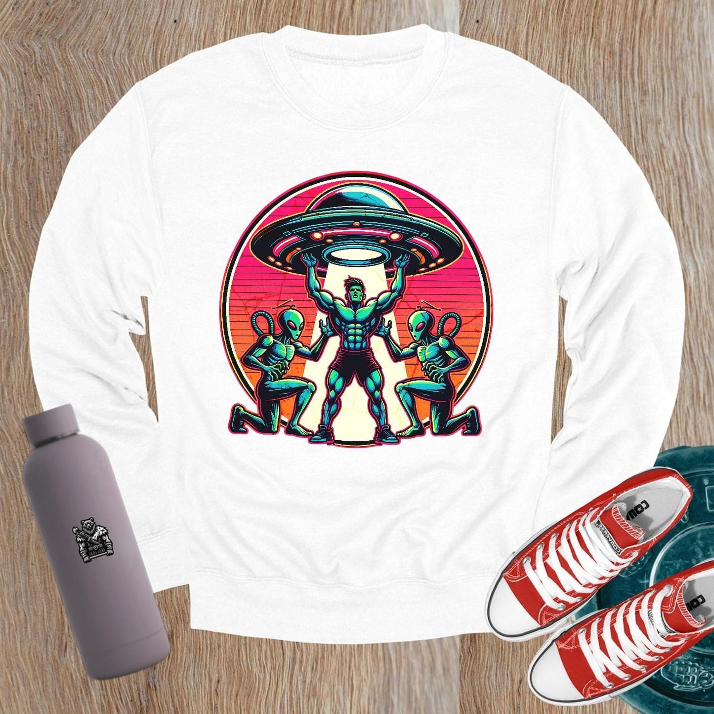 "Bold gym sweatshirt featuring a dynamic graphic of a muscular hero battling aliens, perfect for fitness enthusiasts and casual wear."