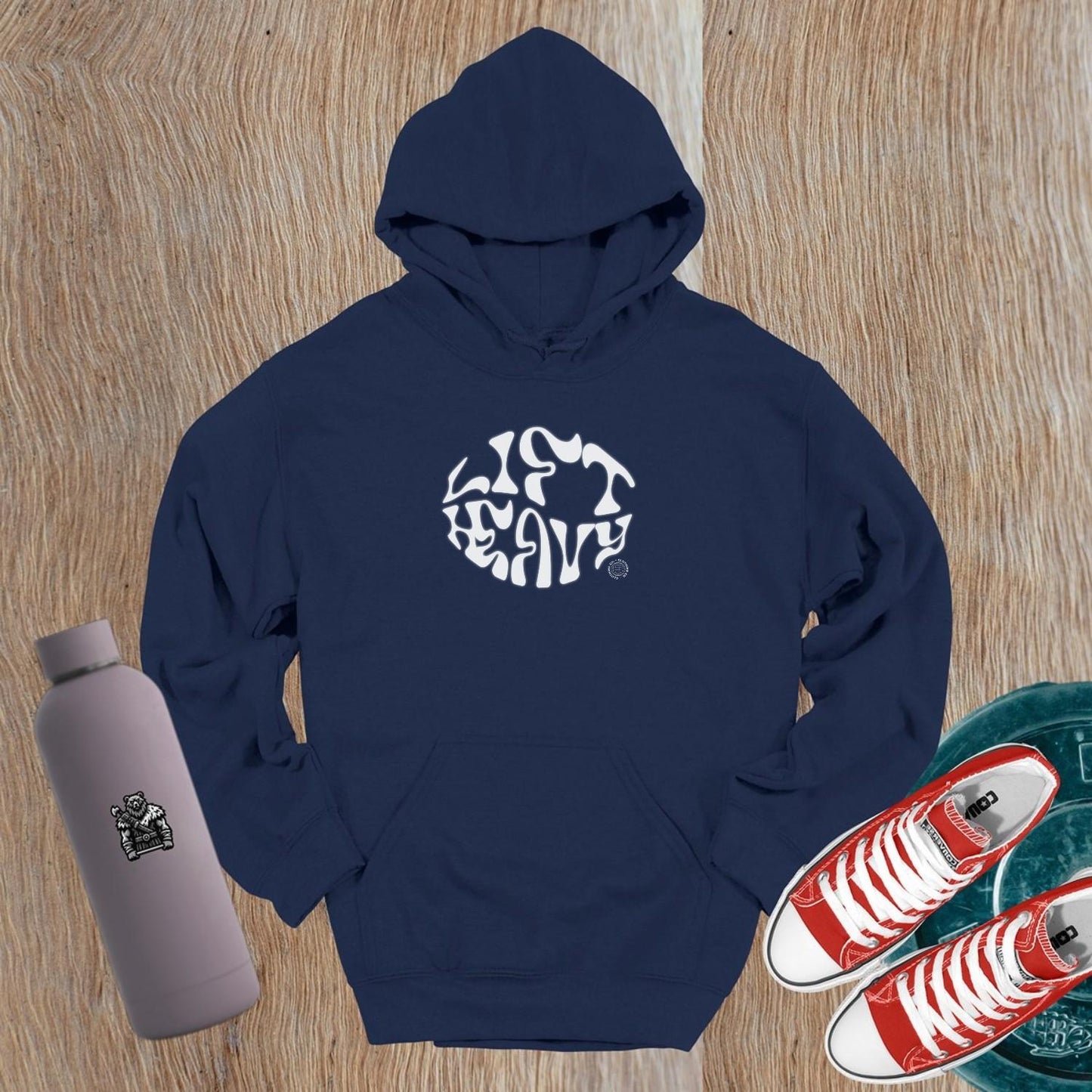 "Bold 'Lift Heavy' hoodie for gym enthusiasts featuring an inspiring graphic, perfect for workouts and everyday wear, combining comfort and style."