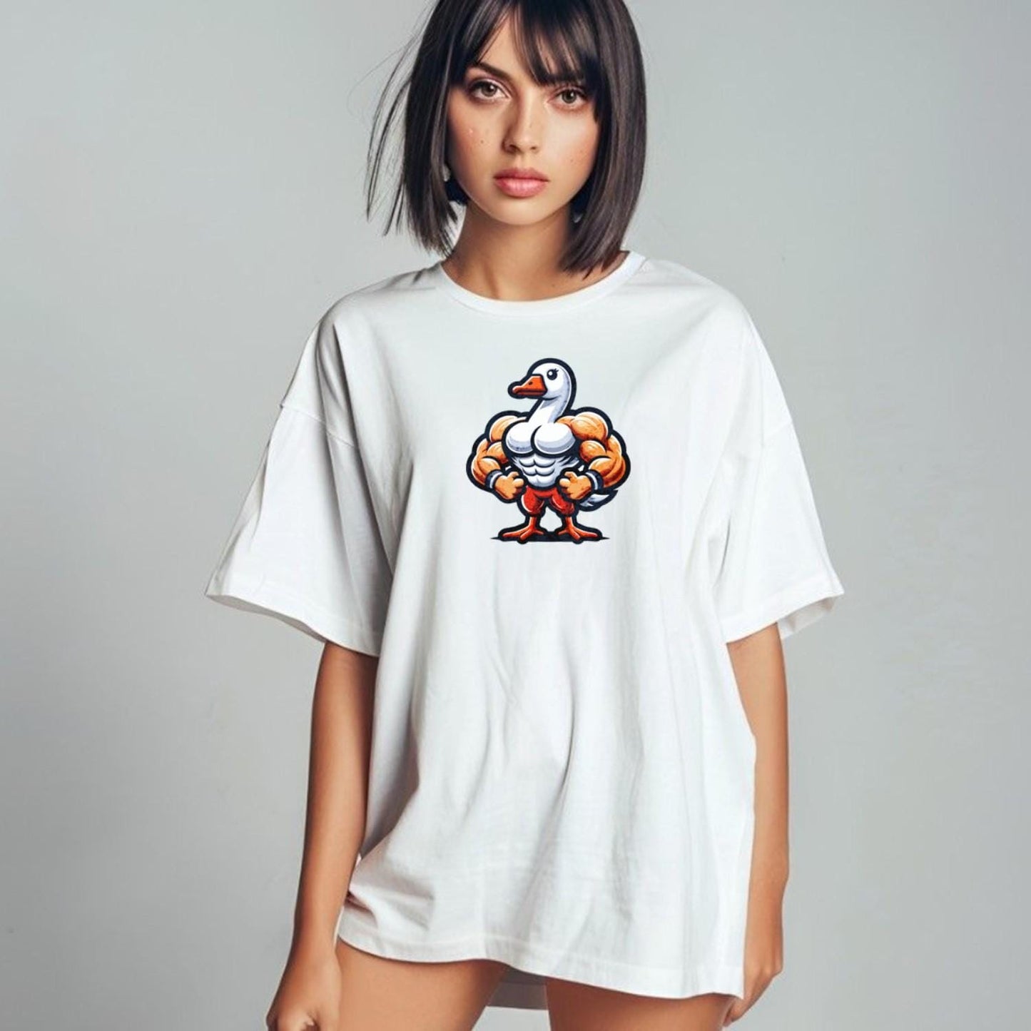 Alt text: "Muscular duck graphic T-shirt for gym enthusiasts, featuring a bold design that combines fun and fitness in a relaxed fit."