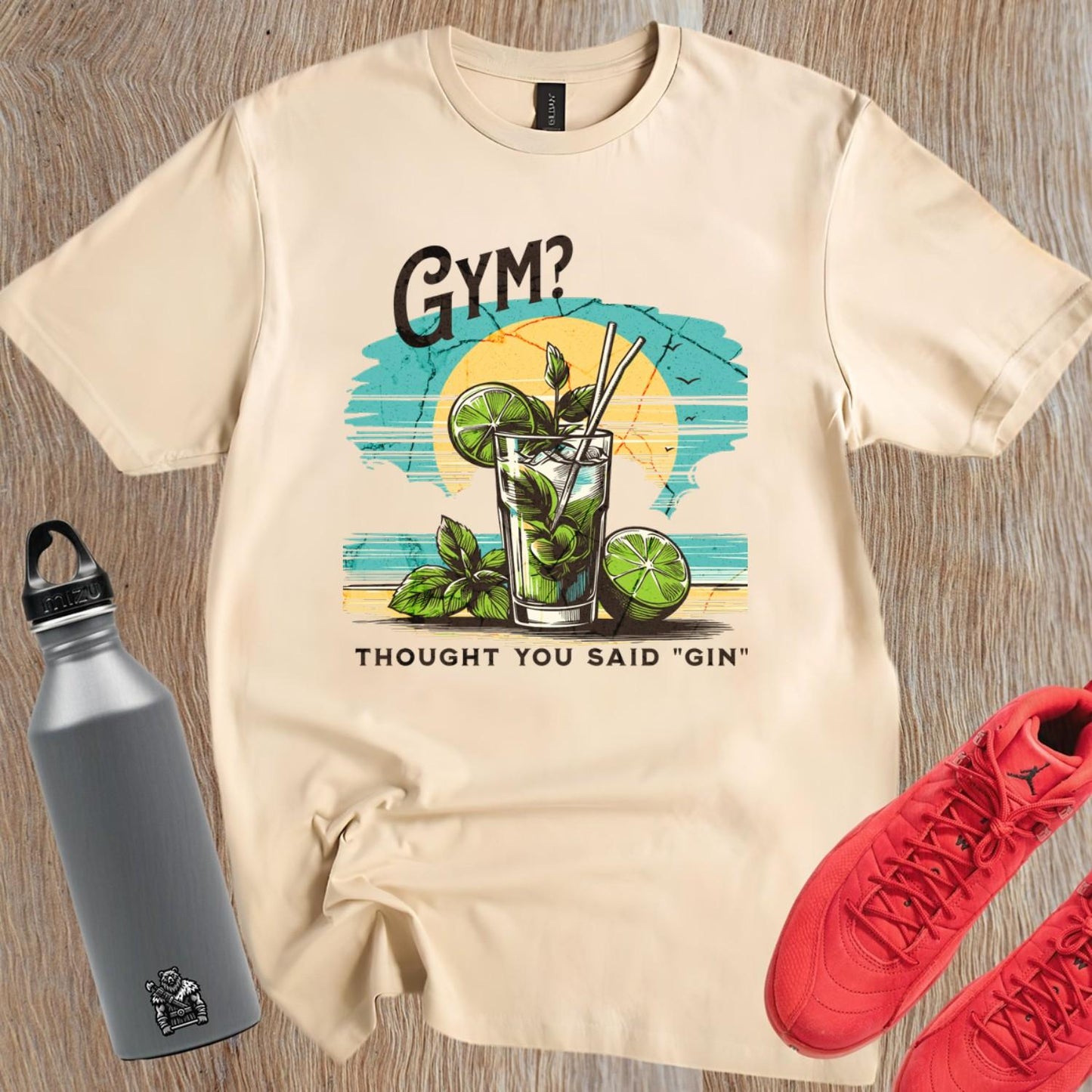 Alt text: "Fun graphic T-shirt featuring the humorous phrase 'GYM? I Thought You Said 'GIN'!' Perfect for fitness lovers and gym enthusiasts."