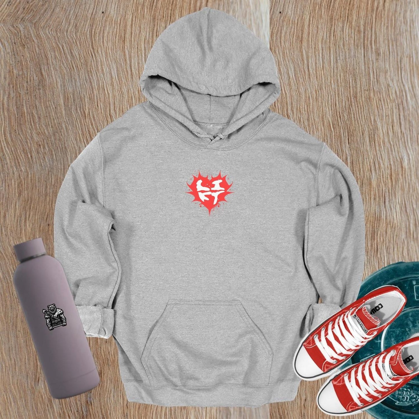 "Bold gym hoodie featuring a vibrant heart graphic and motivational design, perfect for fitness enthusiasts. Relaxed fit for comfort."