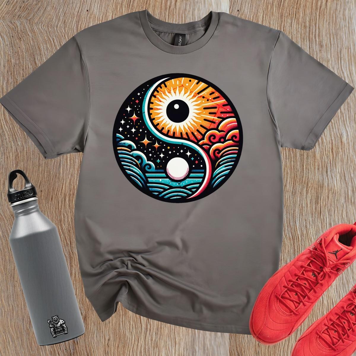 "Vibrant gym T-shirt featuring a bold yin-yang design with sun and moon elements, symbolizing harmony and strength for fitness enthusiasts."