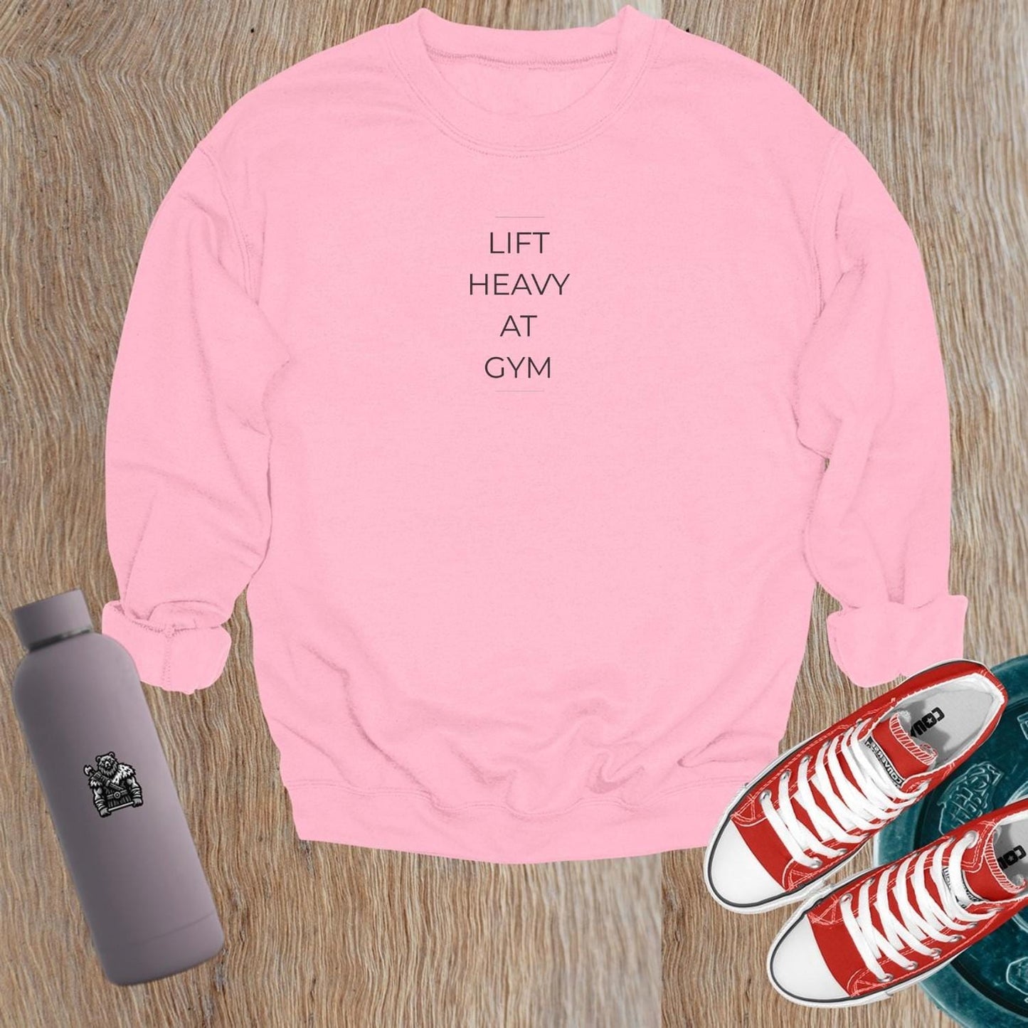 "Lift Heavy at Gym sweatshirt featuring bold lettering, designed for serious lifters, offering comfort and style for workouts."