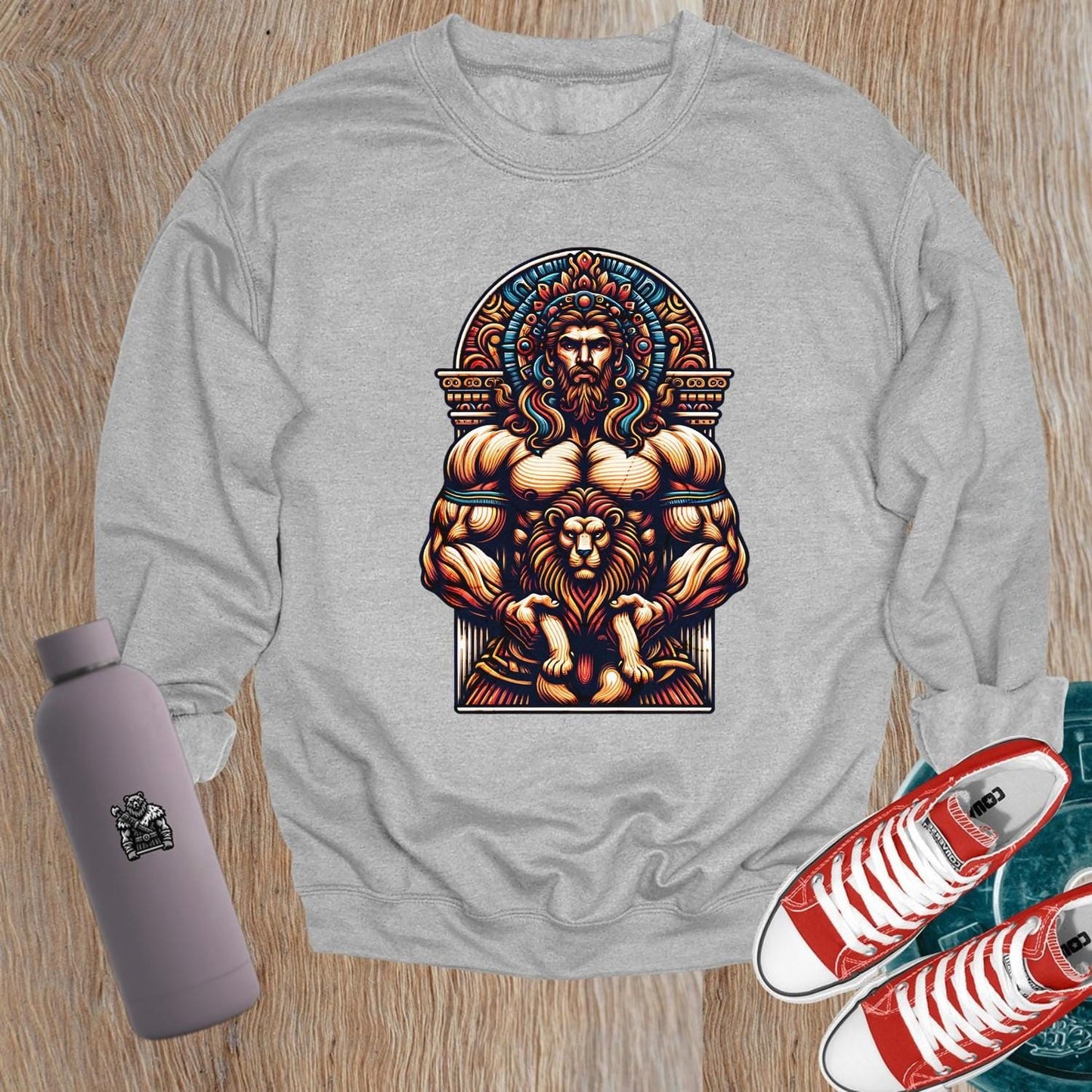 "Bold graphic sweatshirt featuring muscular figure and lion design, symbolizing strength, resilience, and courage for gym enthusiasts."