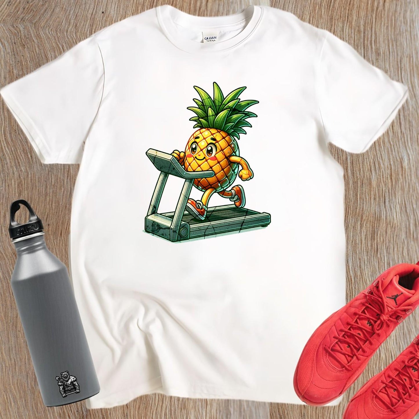 "Bright Pineapple Jogger T-Shirt featuring a cheerful pineapple exercising on a treadmill, promoting fun and motivation in fitness."