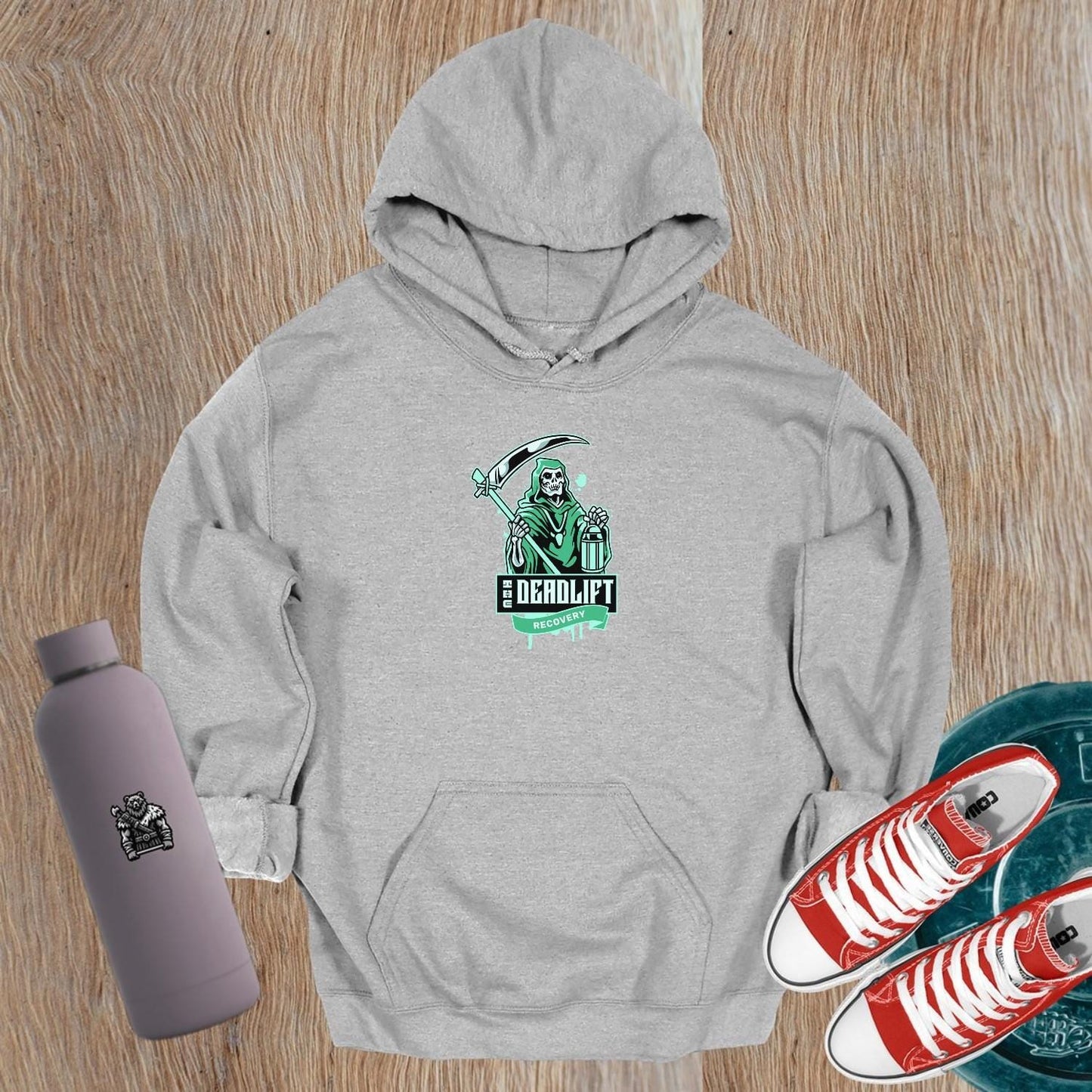 "Bold Deadlift Recovery hoodie featuring a dynamic skeleton graphic, ideal for gym enthusiasts seeking comfort and style in fitness wear."
