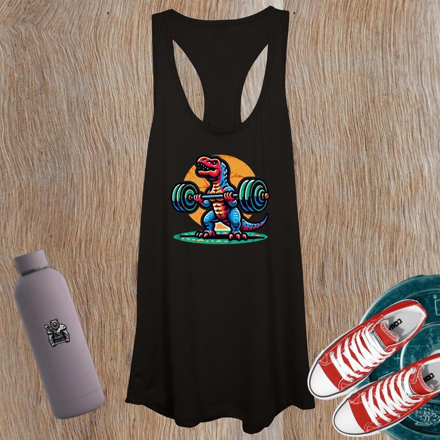 "Vibrant women's tank top featuring a playful dinosaur lifting weights, perfect for gym sessions and casual outings, promoting strength."