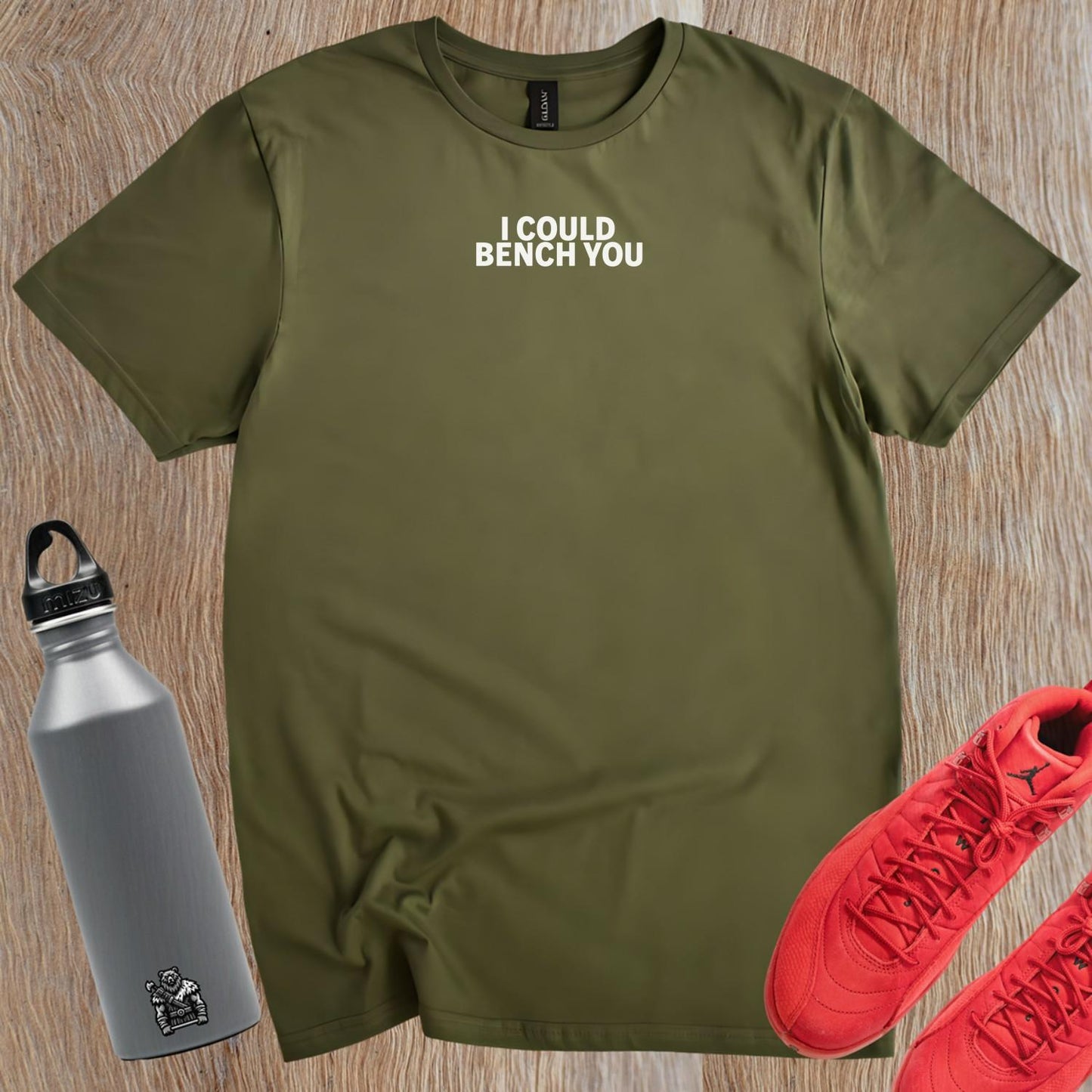 Alt text: "Bold fitness T-shirt featuring 'I Could Bench You' slogan, ideal for gym enthusiasts who lift with confidence and style."