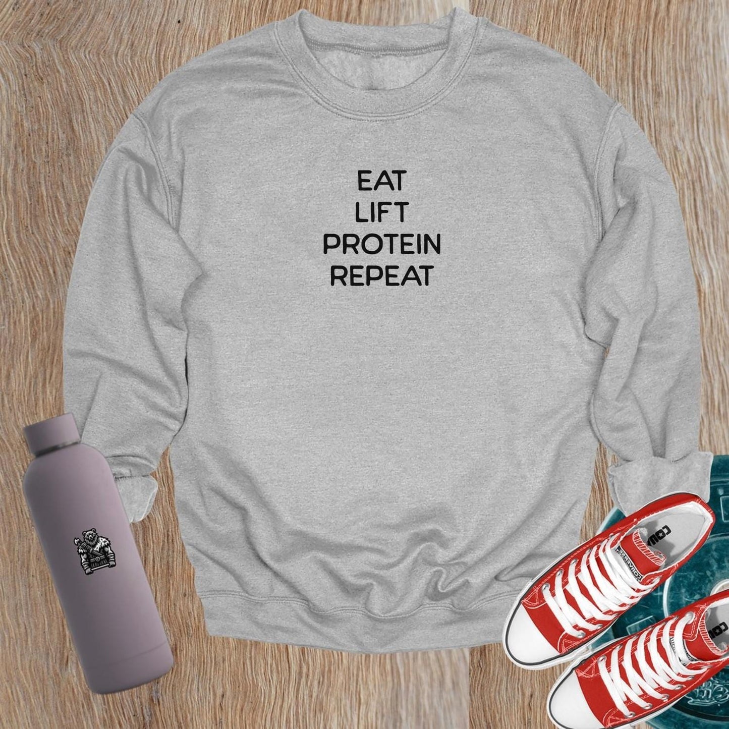 "Dynamic gym sweatshirt featuring a strong logo, perfect for stylish workouts and casual outings, ensuring comfort and performance."