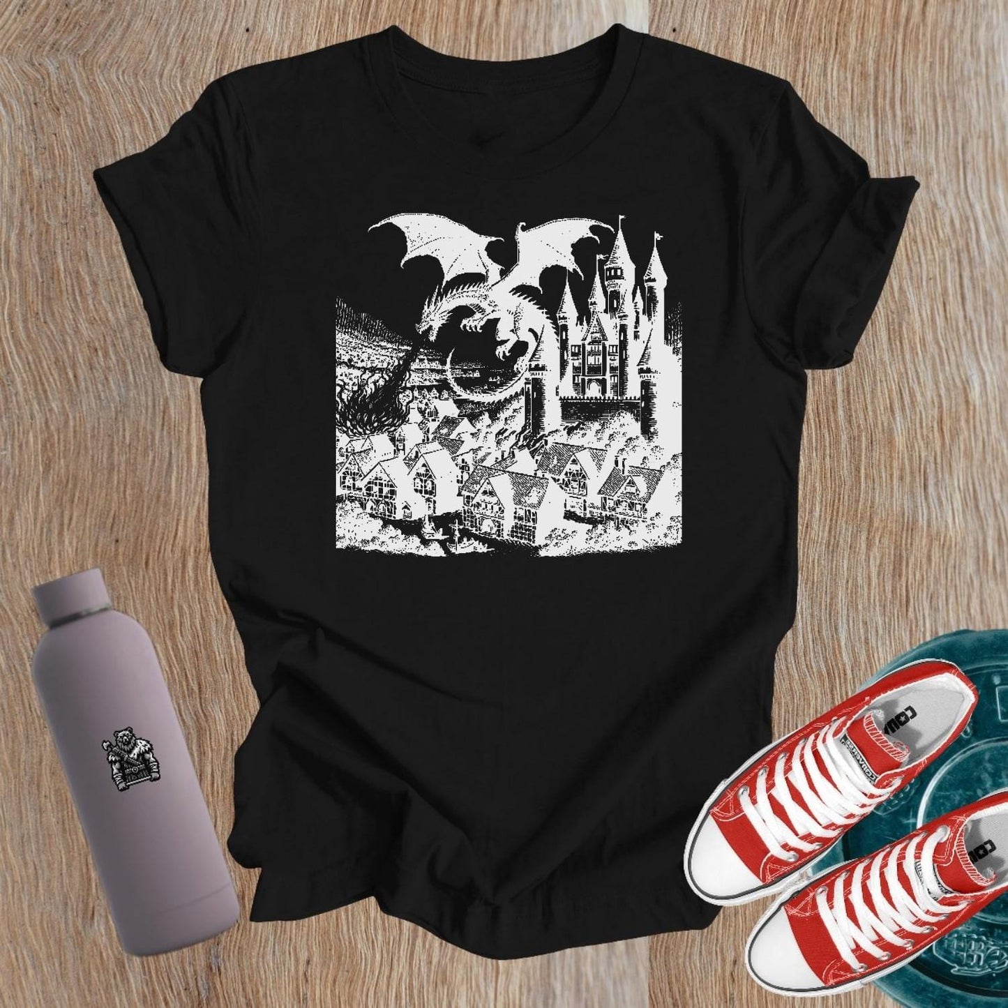 Bold graphic tee featuring a fierce dragon and castle design, perfect for strong women who lift. Ideal gym attire for fitness enthusiasts.