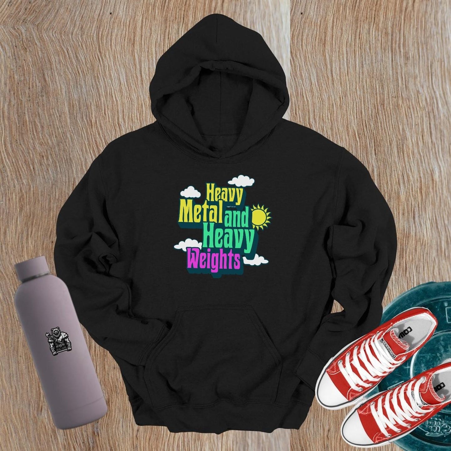 "Heavy Metal and Heavy Weights hoodie featuring vibrant graphics of weights and musical elements, perfect for fitness enthusiasts and gym lovers."
