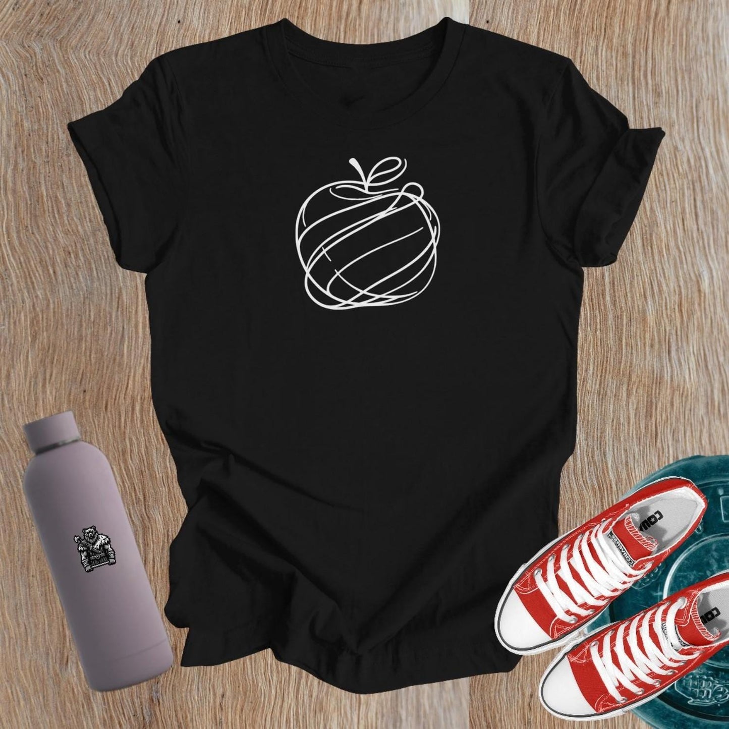 "Empowering women's gym T-shirt with unique apple design, symbolizing health and vitality. Perfect for fitness enthusiasts and lifters."