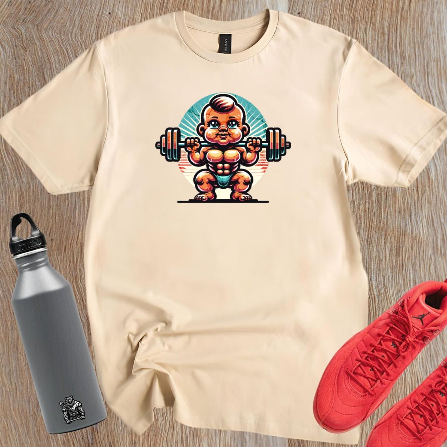 Alt text: "Baby Beast gym T-shirt design featuring a confident baby lifting weights with vibrant colors, perfect for fitness enthusiasts."