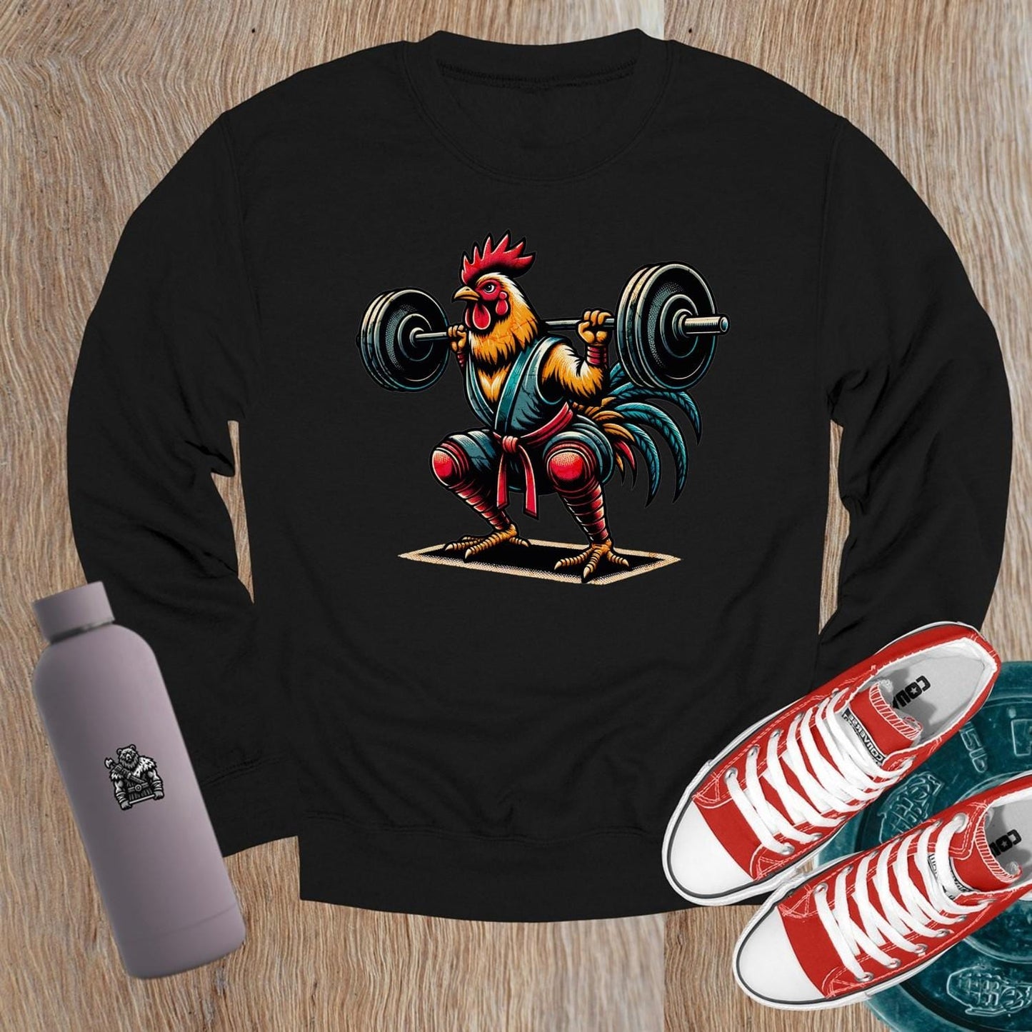 "Fierce weightlifting rooster graphic on a stylish crewneck sweatshirt, perfect for gym enthusiasts. Bold design boosts workout motivation."