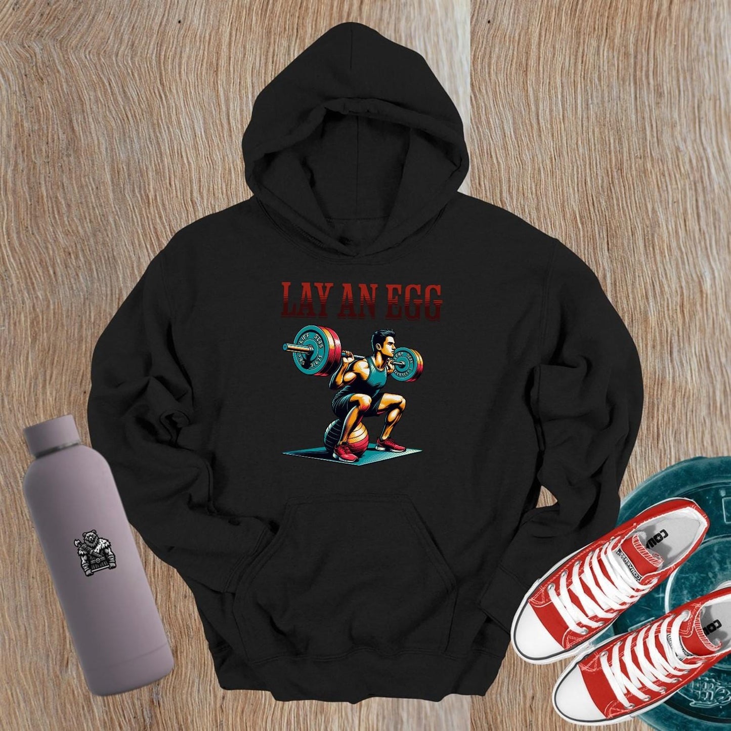 "Colorful gym hoodie featuring a dynamic weightlifter graphic, designed for fitness enthusiasts seeking style and motivation."