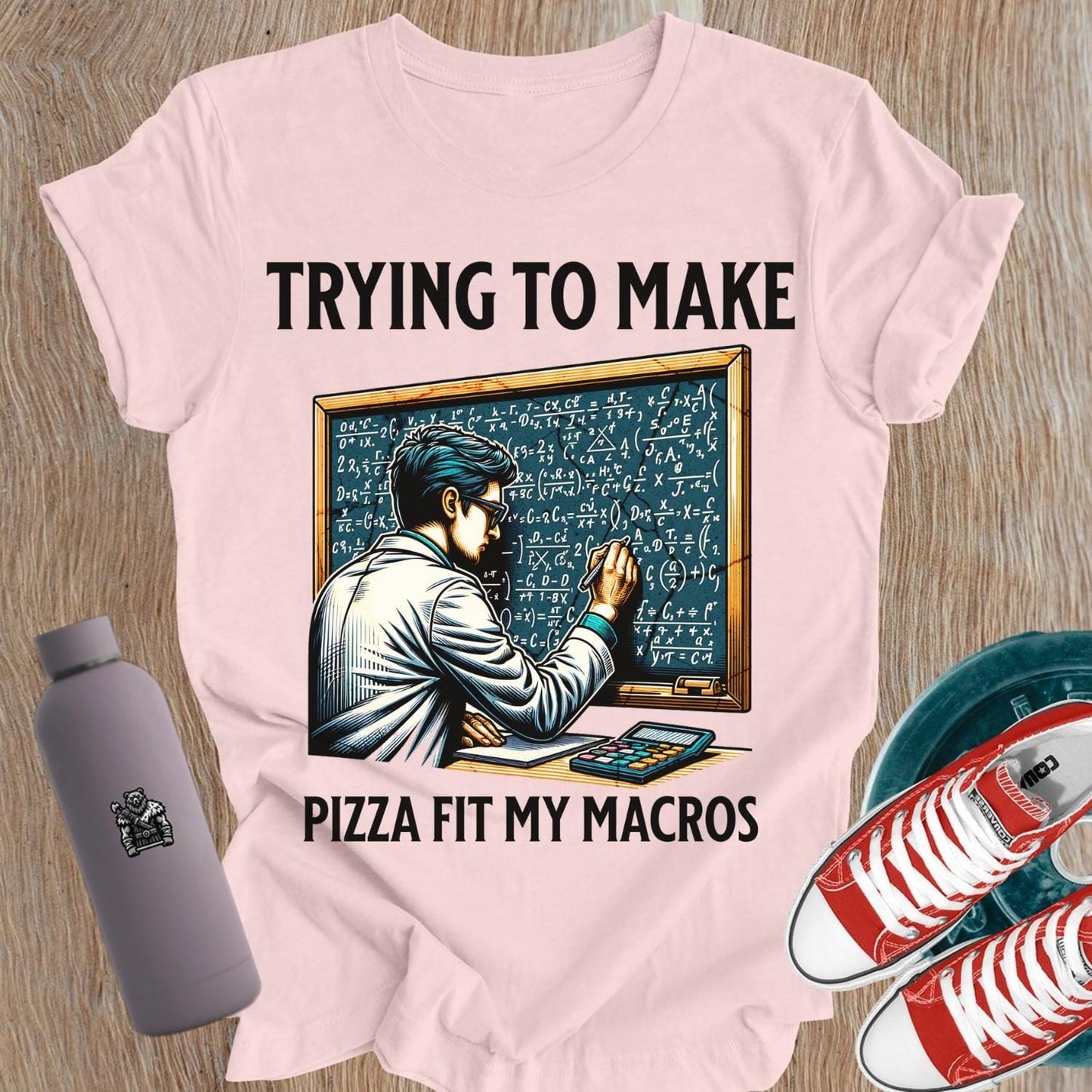 Alt text: "A humorous women’s fitness T-shirt featuring the phrase 'Trying to Make Pizza Fit My Macros'. Ideal for gym lovers, this playful design combines strength and balance, perfect for those who lift. Showcases a vibrant graphic, inspiring fitness journeys and conversations at the gym."