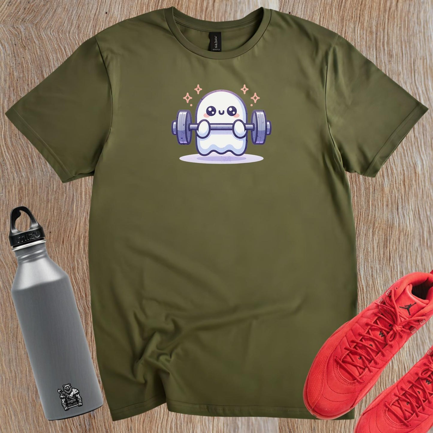 "Playful ghost lifting weights design on gym T-shirt, blending fitness motivation with whimsical charm for workout and casual wear."