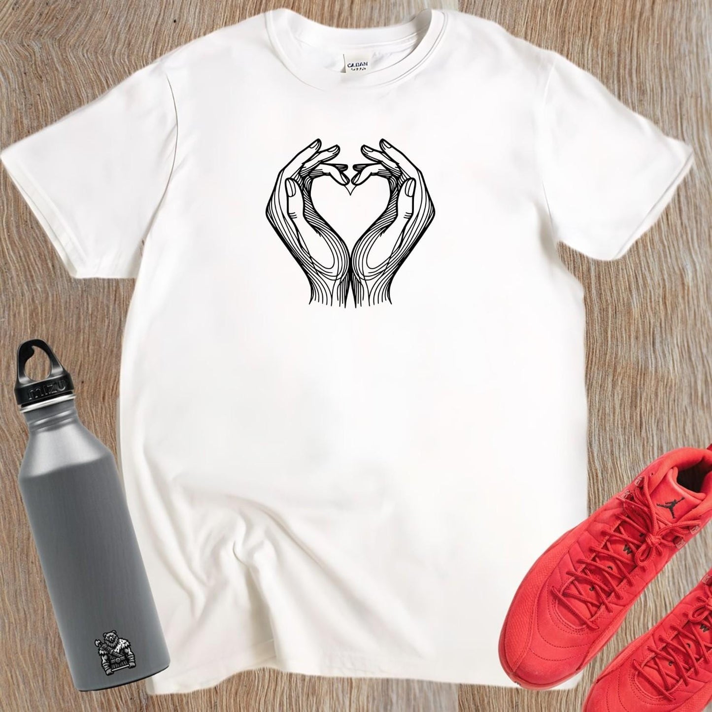 "Heart Hands T-Shirt featuring a bold heart design created by two hands, perfect for gym workouts and casual fitness wear."
