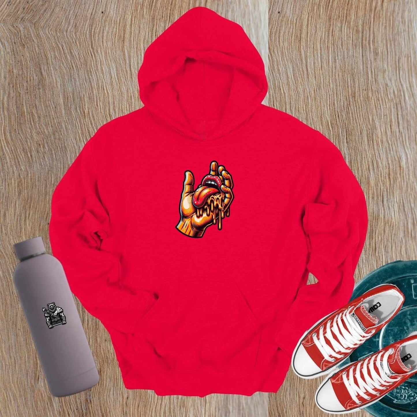 "Bold gym hoodie featuring vibrant graphic of a hand and dripping tongue, perfect for workouts and casual outings, embodying fierce style."