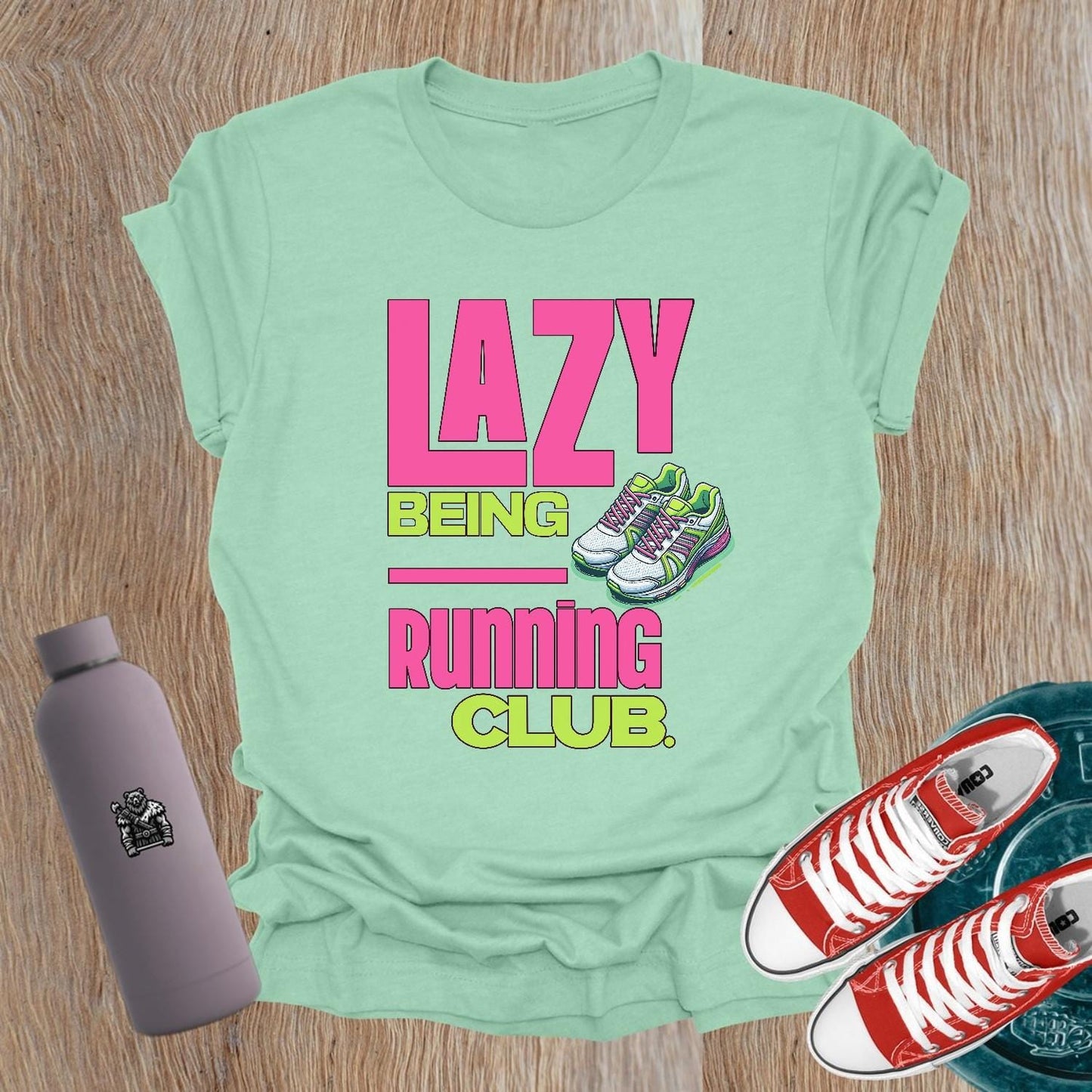 Alt text: "Fierce women's gym t-shirt featuring 'Lazy Being Running Club' bold graphic, perfect for lifting, workouts, and expressing strength."