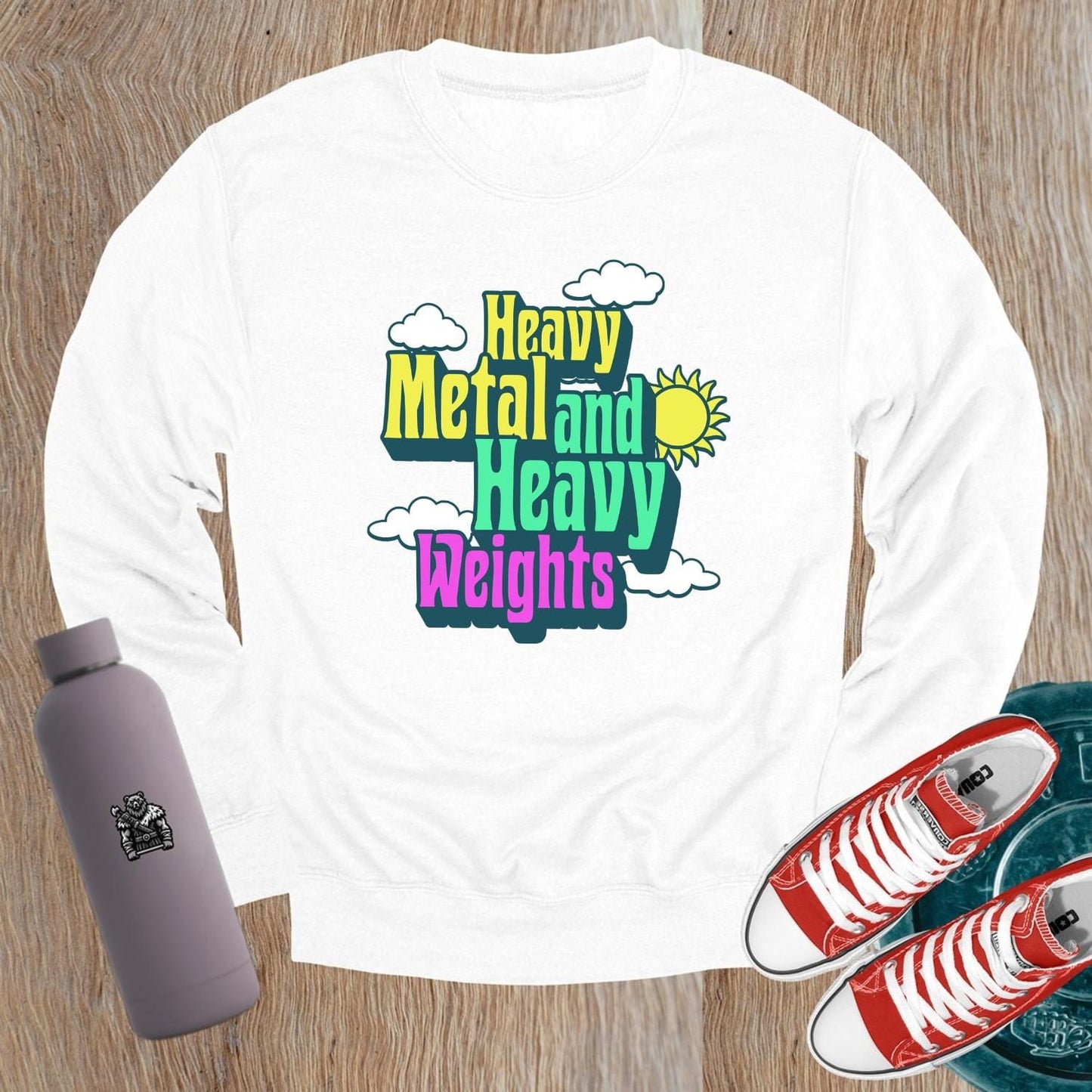 "Vibrant 'Heavy Metal and Heavy Weights' sweatshirt featuring bold graphics, perfect for gym enthusiasts and music lovers, ideal for workouts."