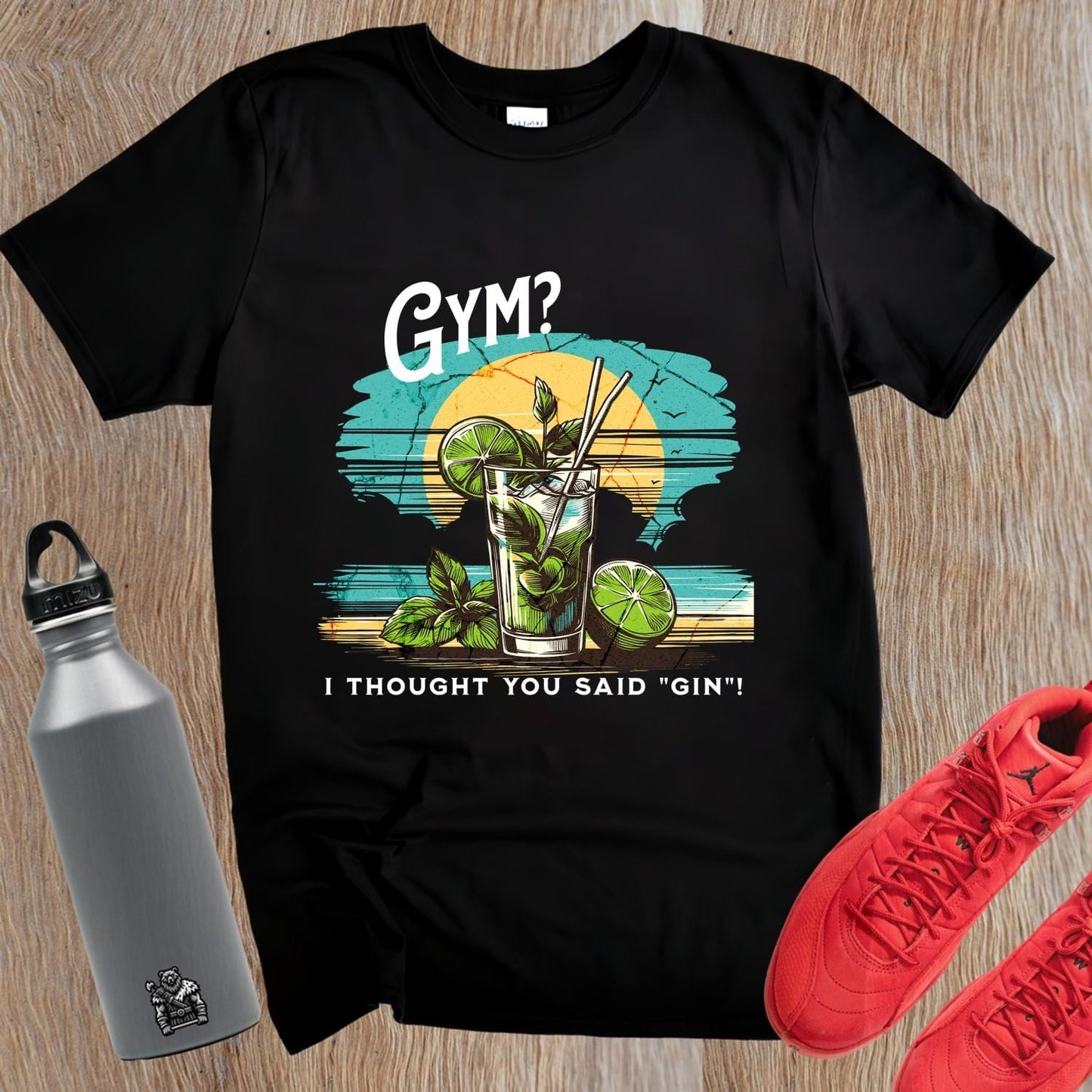"Vibrant gym T-shirt featuring a colorful cocktail design with the playful phrase 'I thought you said “gin”!' Ideal for fitness lovers."