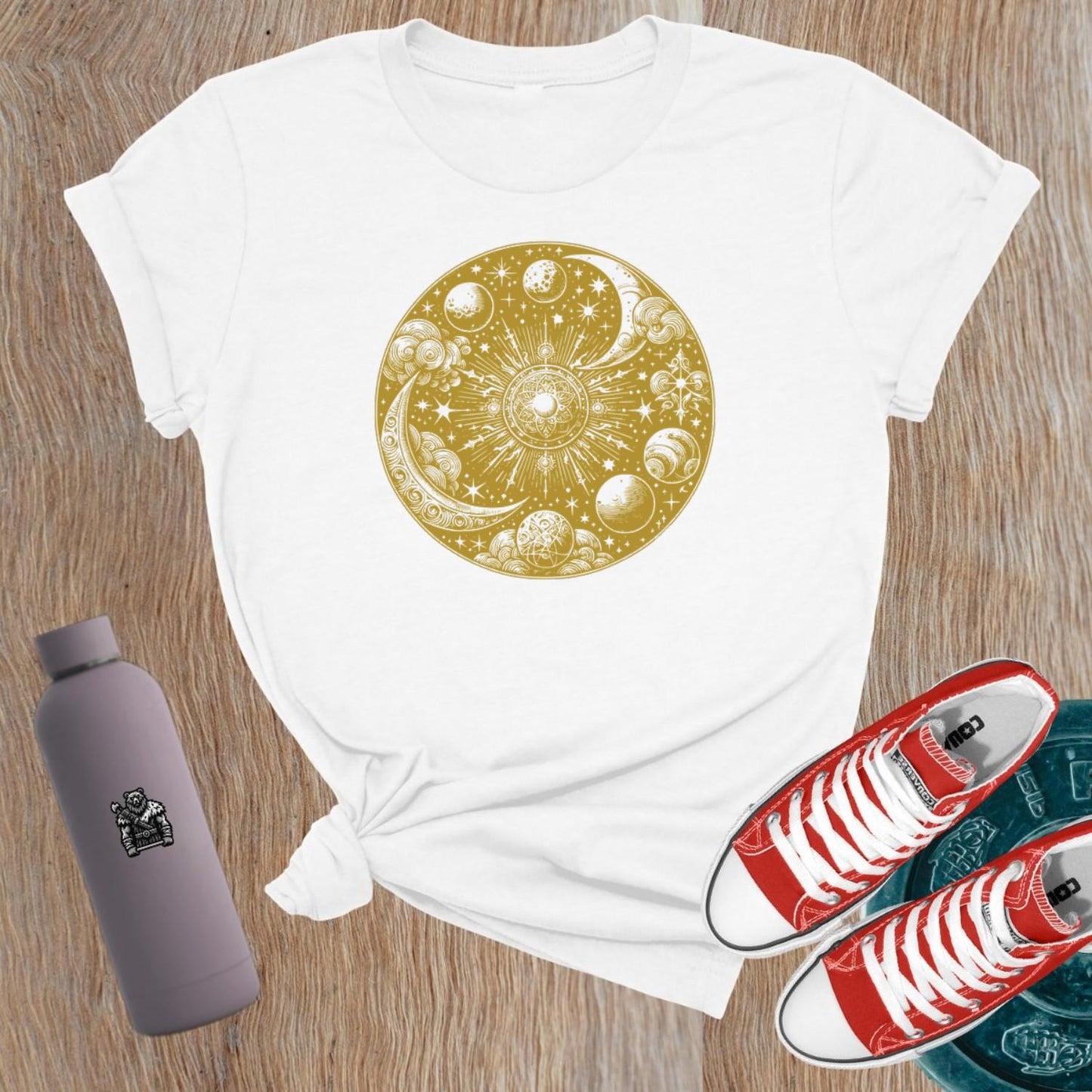 "Women's celestial design gym tee featuring strength symbols, perfect for weightlifting and activewear, blending flair with functionality."