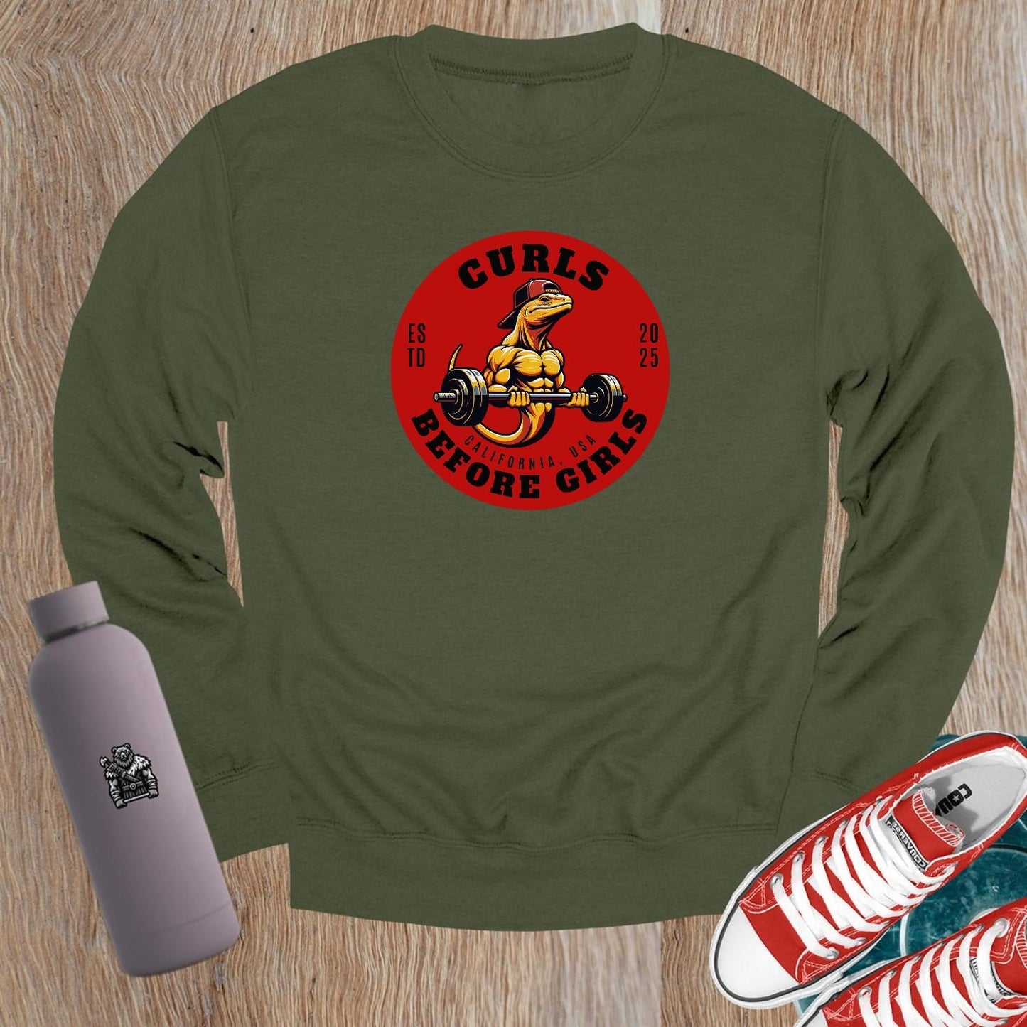 "Dark crewneck sweatshirt featuring 'Curls Before Girls' slogan, vibrant fitness mascot, perfect for workouts and casual lounging."