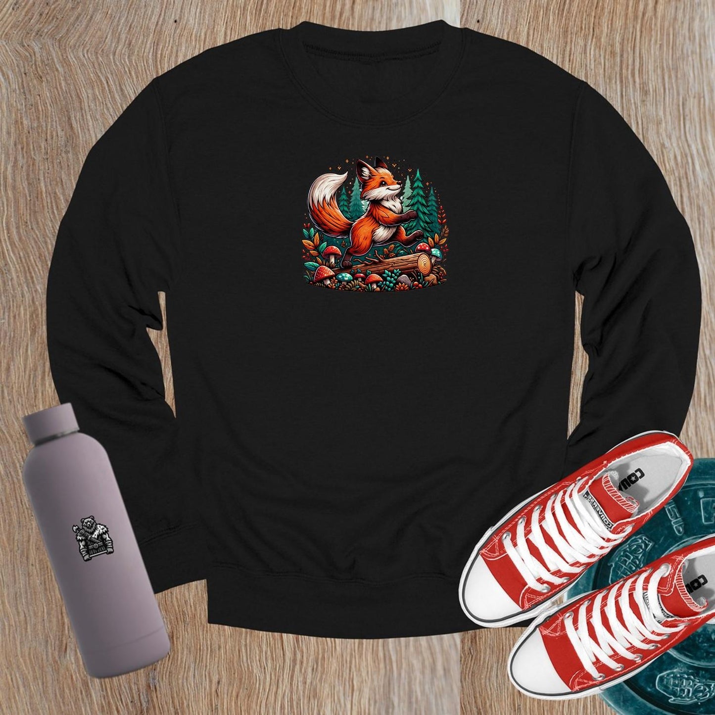"Vibrant crewneck sweatshirt featuring a playful fox among lush trees and whimsical mushrooms, perfect for gym or casual outings."