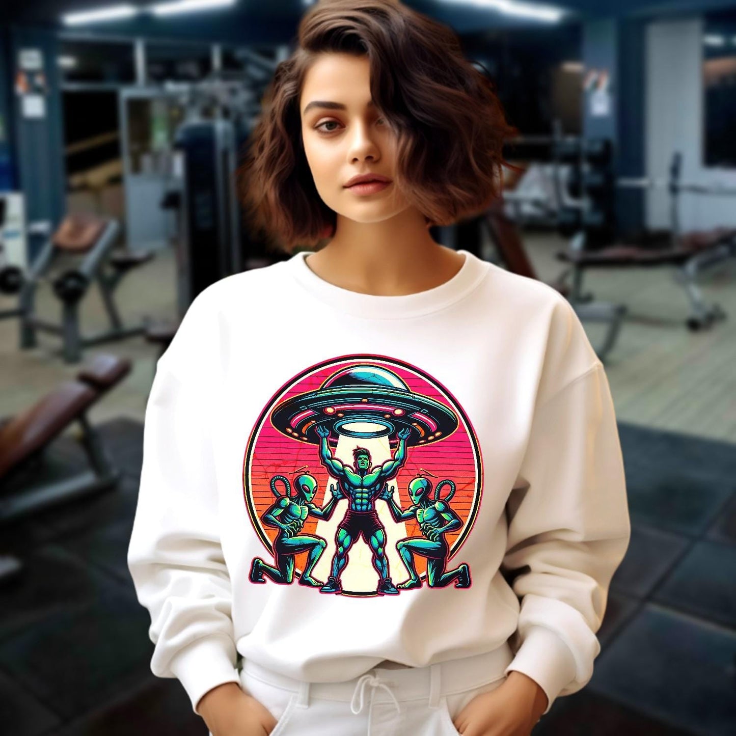 "Bold gym sweatshirt featuring a dynamic graphic of a muscular hero battling aliens, perfect for fitness enthusiasts and casual wear."