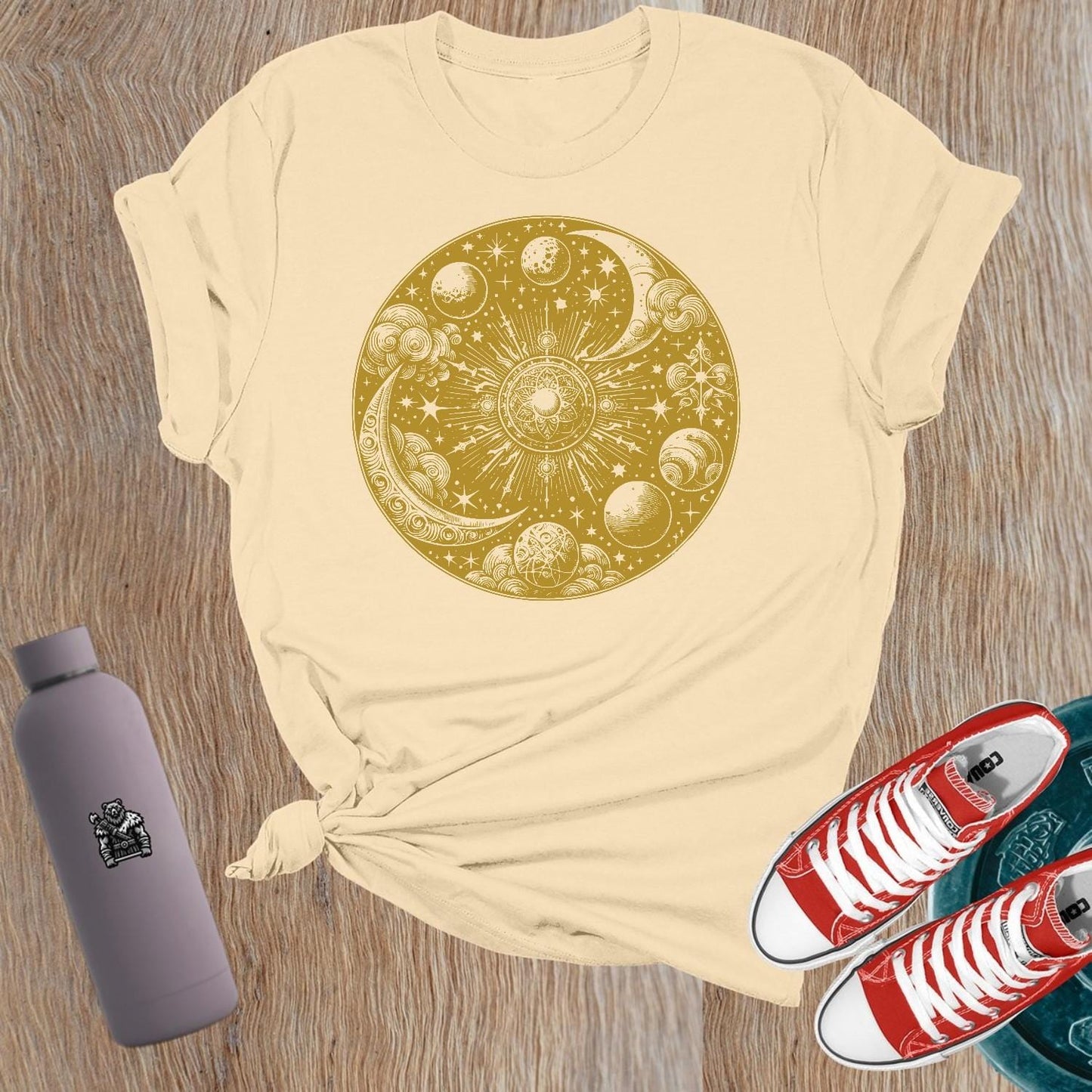 "Women's celestial design gym tee featuring strength symbols, perfect for weightlifting and activewear, blending flair with functionality."