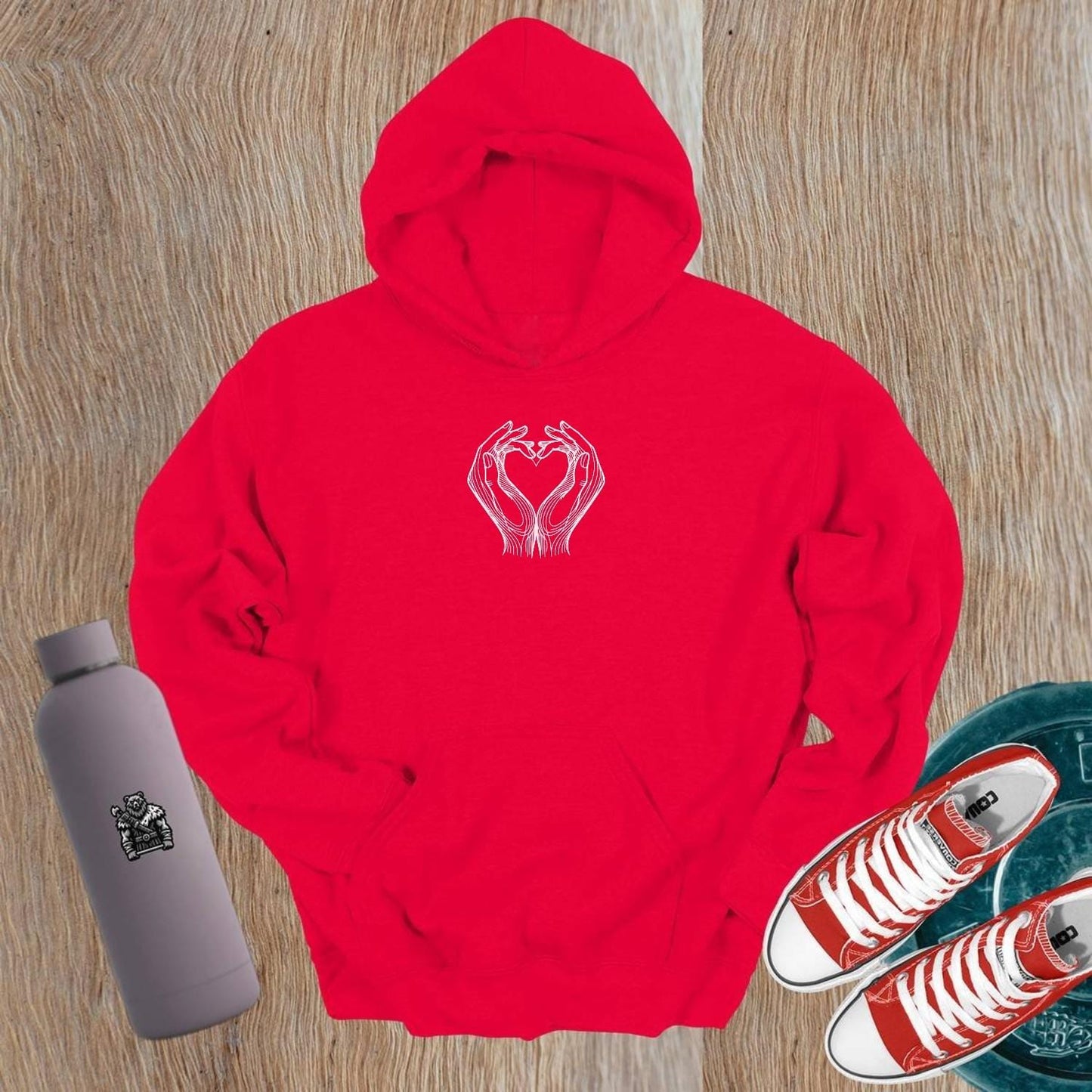 "Stylish gym hoodie with heart-shaped hand design symbolizing strength and unity, perfect for workouts and casual wear."