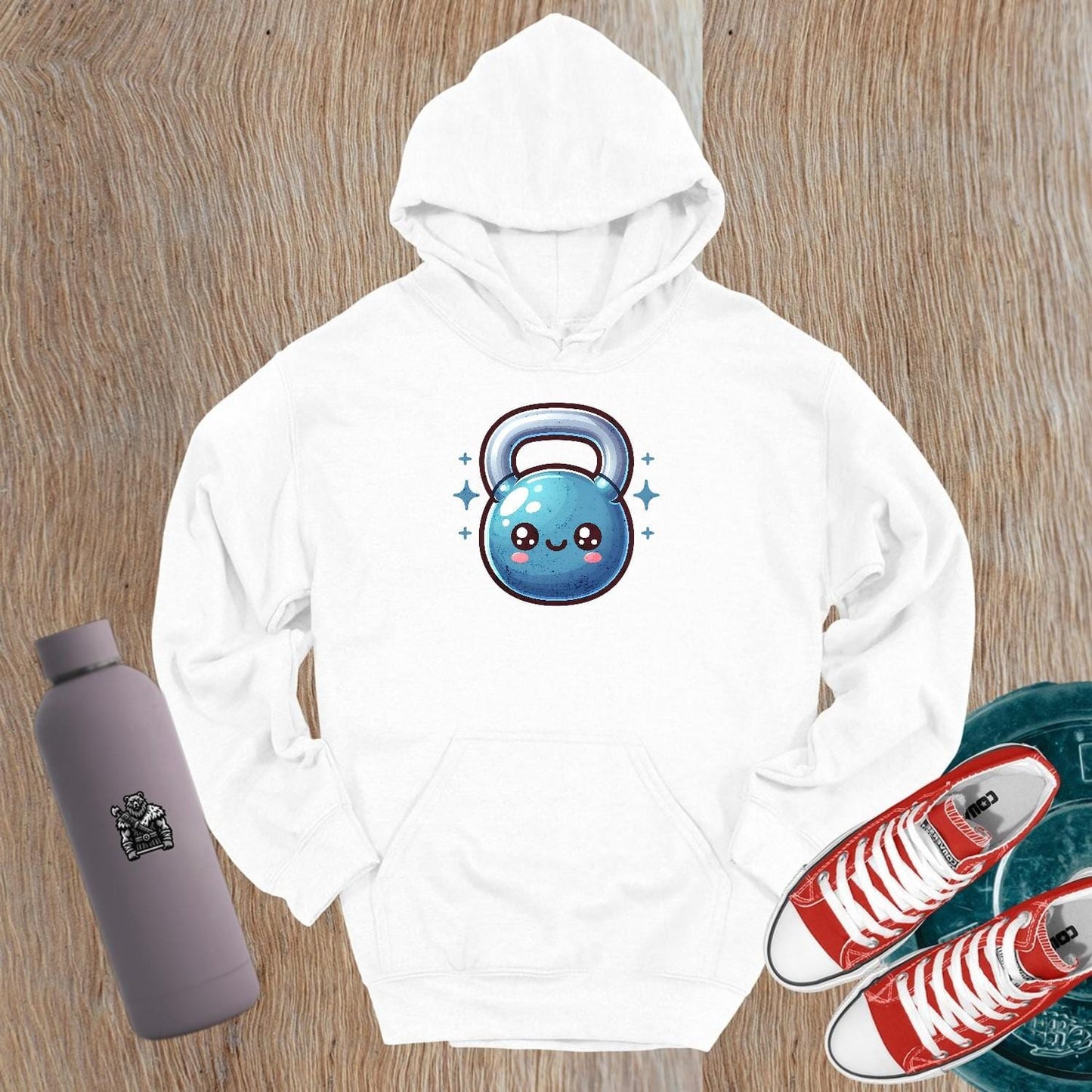 "Stylish gym hoodie featuring a smiling kettlebell design, perfect for workouts and casual outings, showcasing fitness passion."