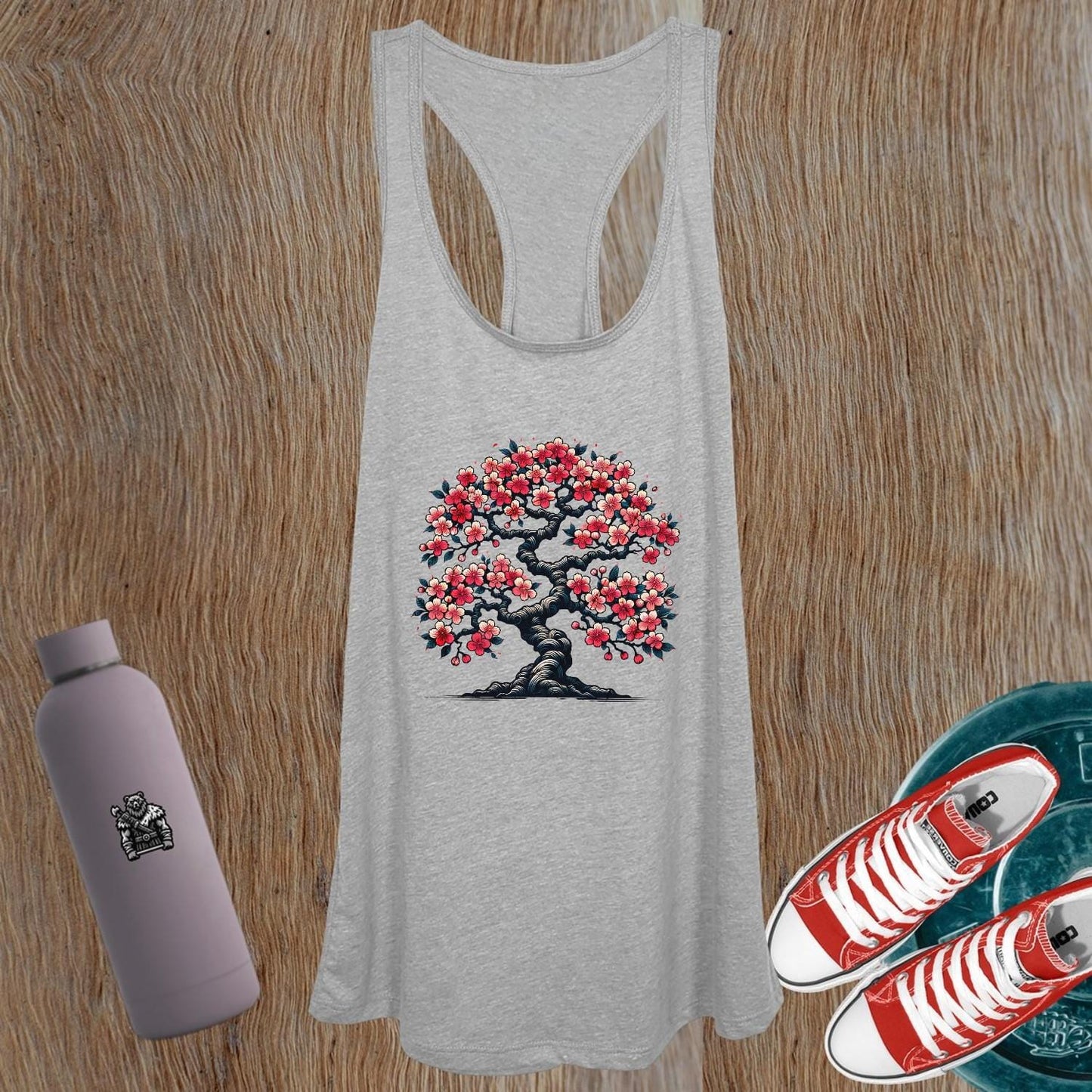 "Women's gym tank top featuring a vibrant blossom tree design symbolizing strength and growth, perfect for workouts and casual outings."