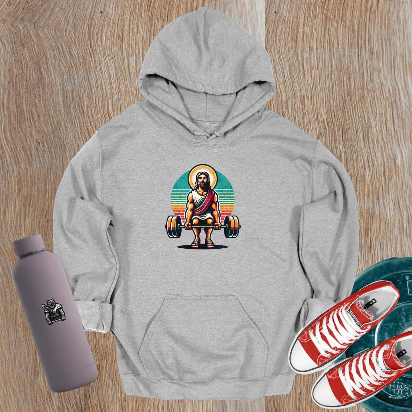 "Retro gym hoodie featuring bold graphic design, showcasing strength and resilience. Ideal for fitness enthusiasts and workouts."