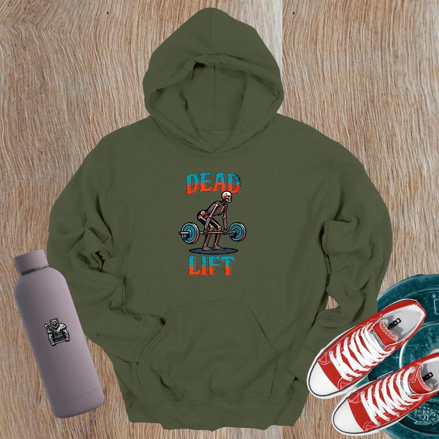 "Black 'Dead Lift' hoodie featuring a striking skeleton design, perfect for gym wear, fitness enthusiasts, and post-workout style."