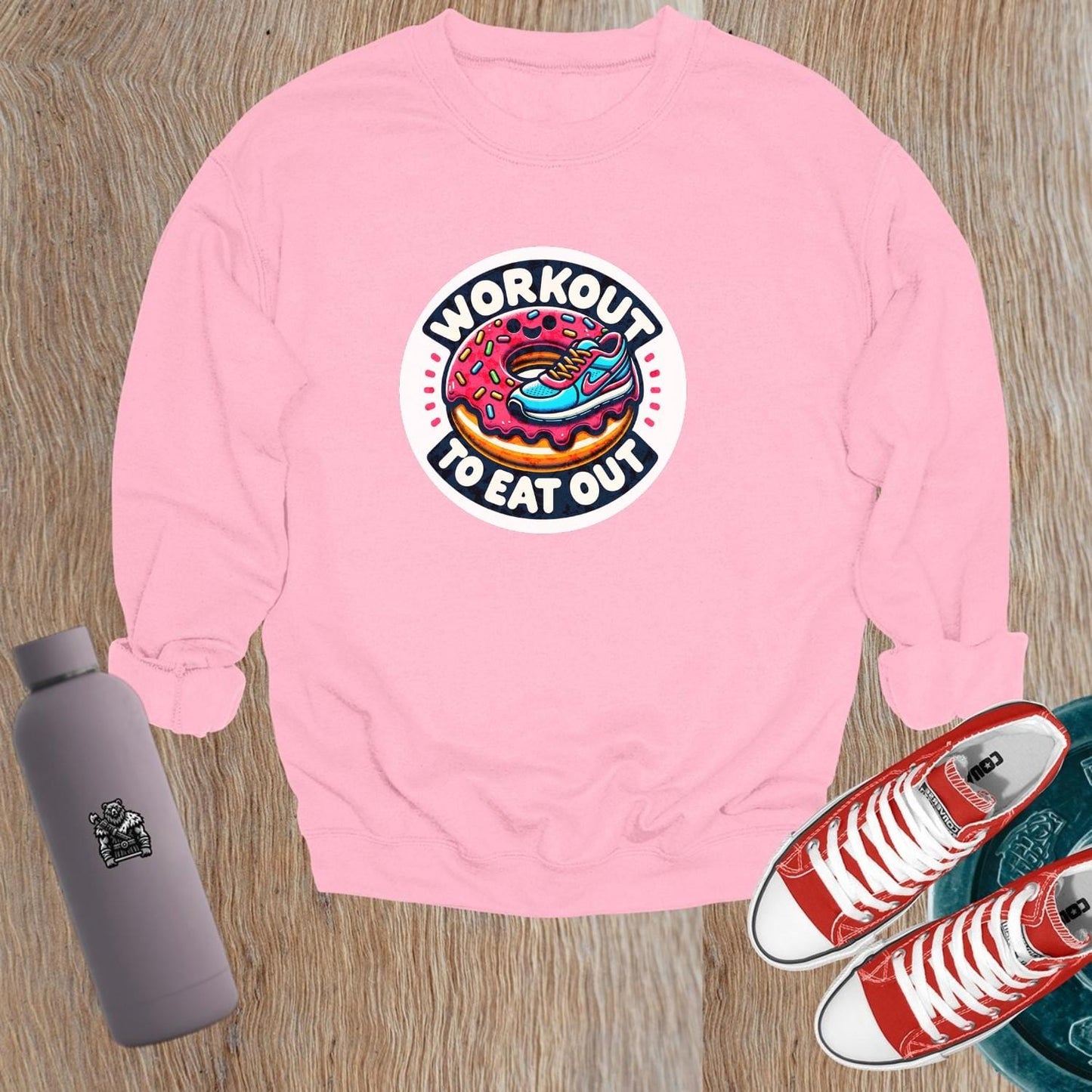 Alt text: "Graphic sweatshirt featuring a vibrant sneaker and donut design, perfect for gym enthusiasts who balance fitness and indulgence."