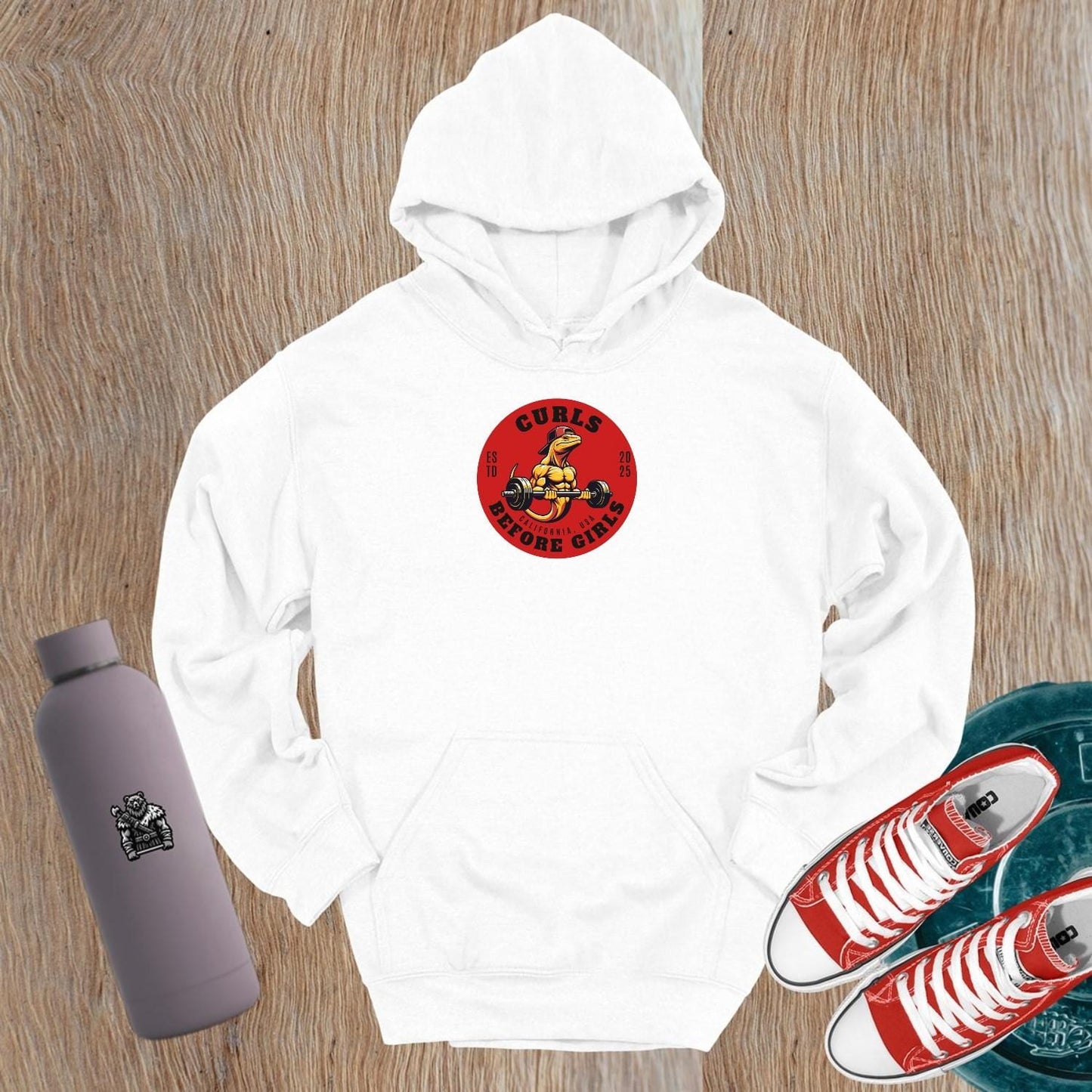 "Graphic hoodie featuring 'Curls Before Girls' slogan, vibrant design for fitness enthusiasts, perfect for gym and casual wear."