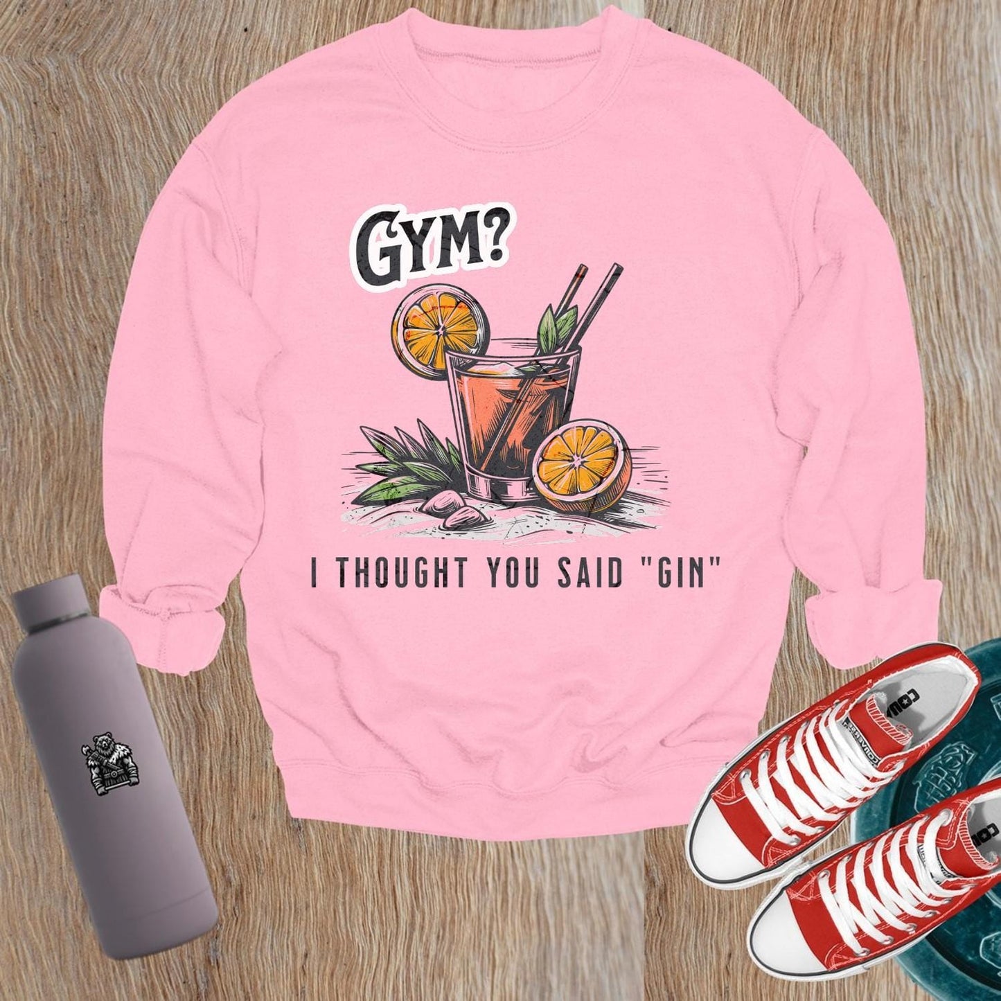 Alt text: "Playful 'Gym? I Thought You Said Gin' graphic sweatshirt for gym enthusiasts, blending fitness humor and style. Perfect for casual wear."