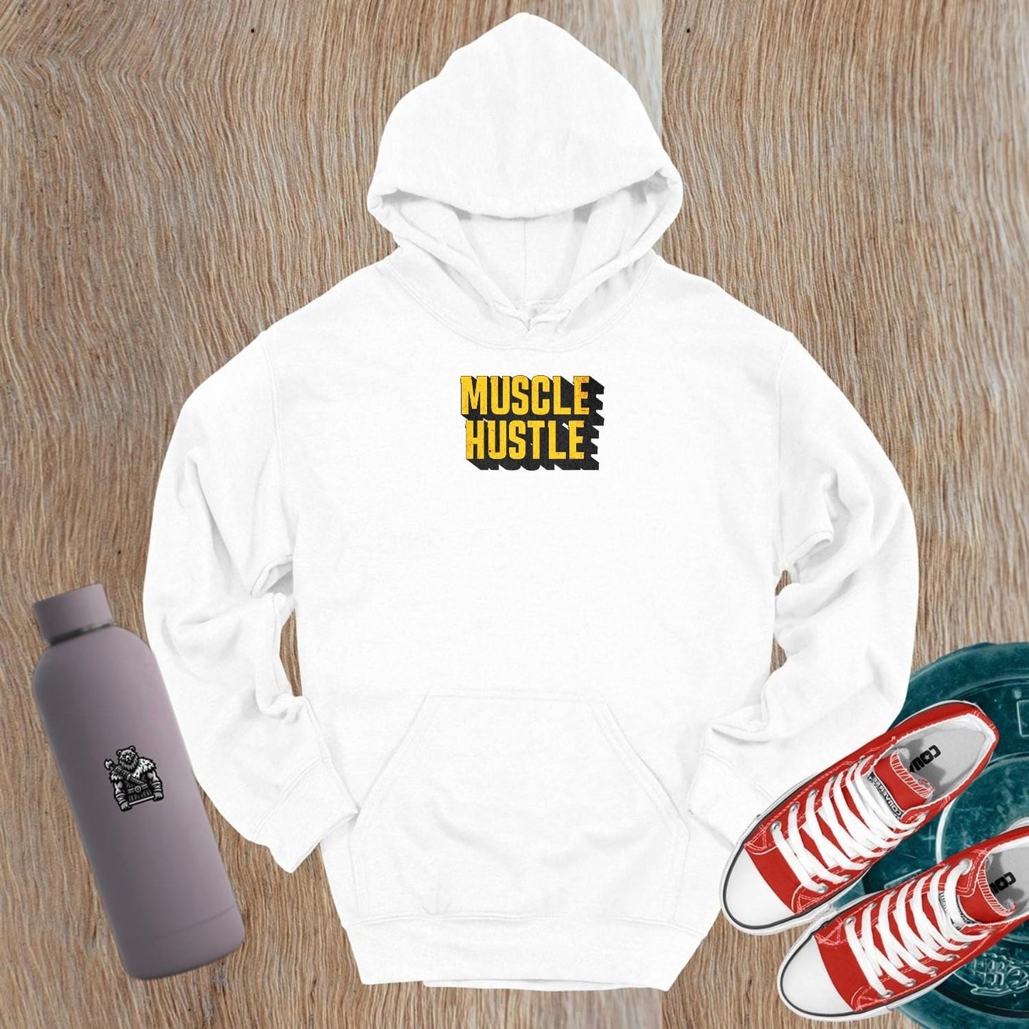 Alt text: "Muscle Hustle hoodie featuring a bold graphic design that symbolizes strength and determination, perfect for fitness enthusiasts."