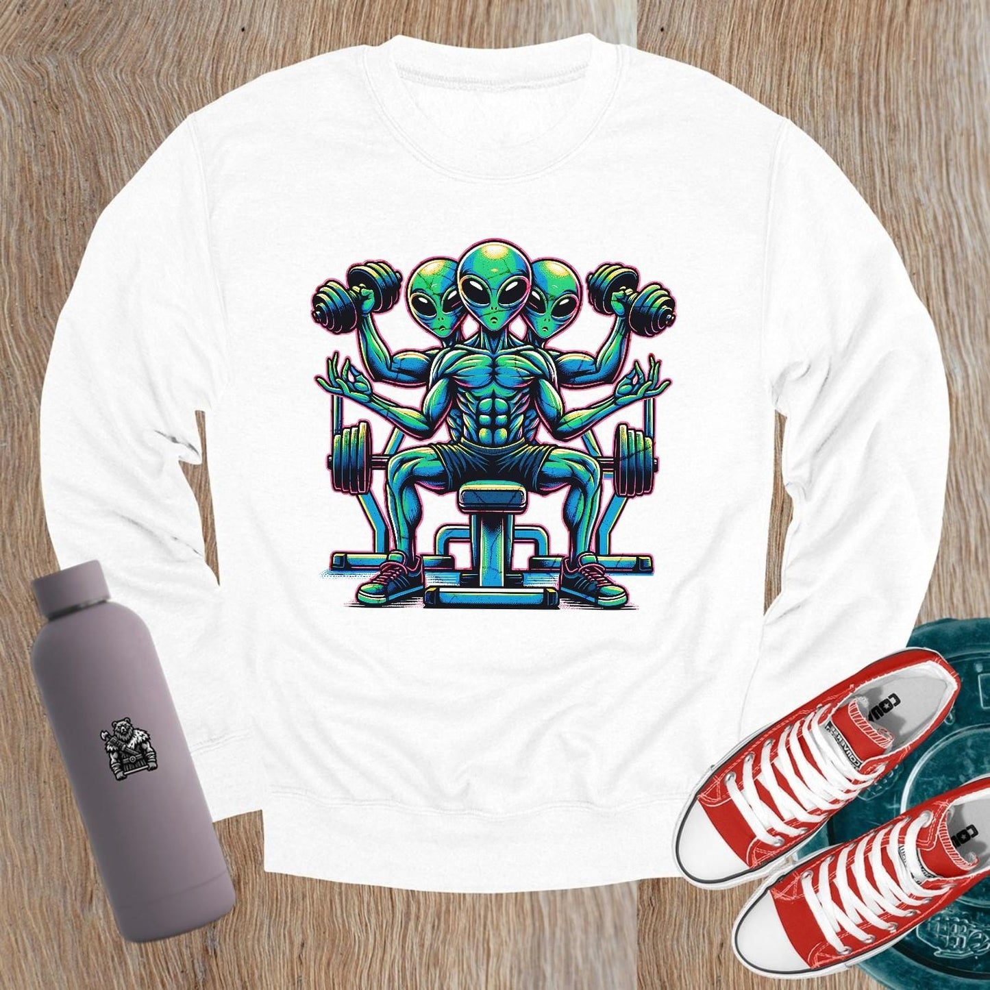 "Vibrant gym sweatshirt featuring a bold alien lifter graphic, perfect for fitness enthusiasts. Energetic design for workouts and casual wear."