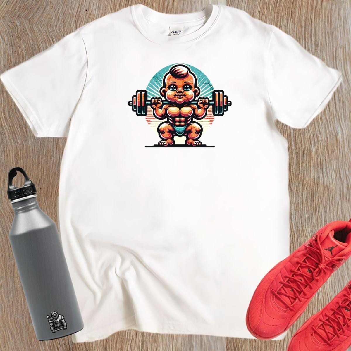 Alt text: "Baby Beast gym T-shirt design featuring a confident baby lifting weights with vibrant colors, perfect for fitness enthusiasts."